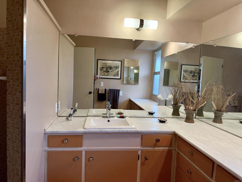 37800 Da Vall Drive, Unit 10 Rancho Mirage, CA 92270 - Photo 13 of 31 a bathroom with a sink and a mirror