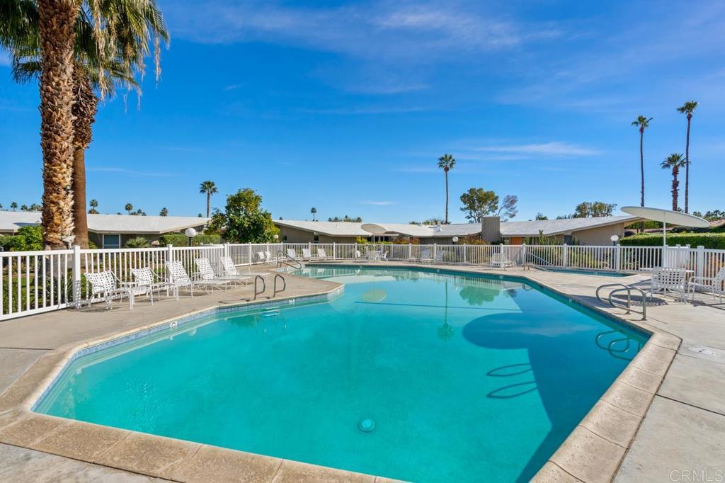 37800 Da Vall Drive, Unit 10 Rancho Mirage, CA 92270 - Photo 22 of 31 a view of a swimming pool with a deck and a patio