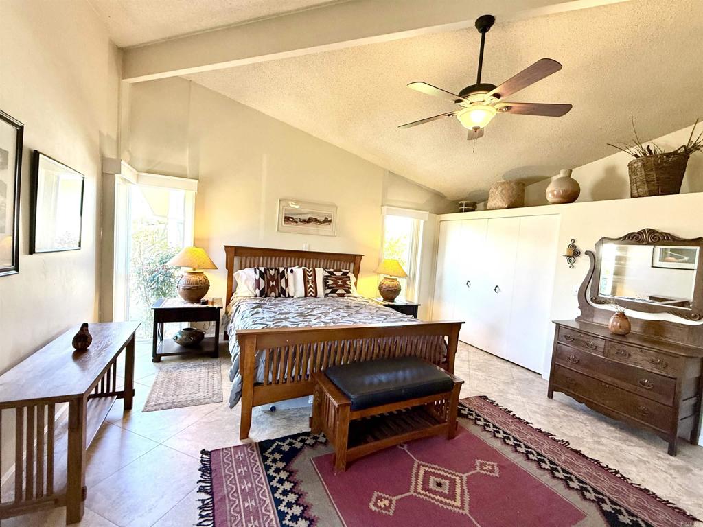 37800 Da Vall Drive, Unit 10 Rancho Mirage, CA 92270 - Photo 10 of 31 a bedroom with a bed and wooden floor