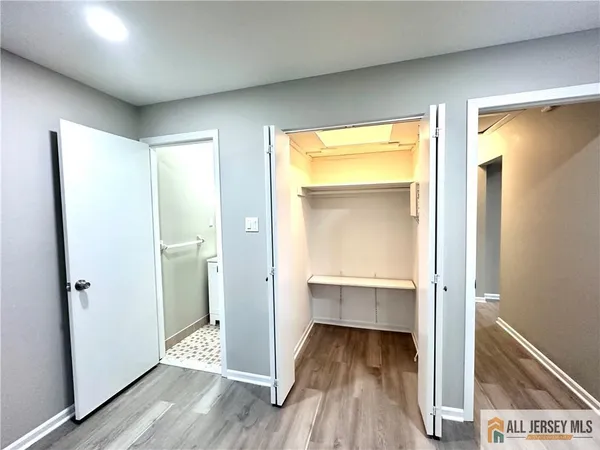 a view of front door with wooden floor