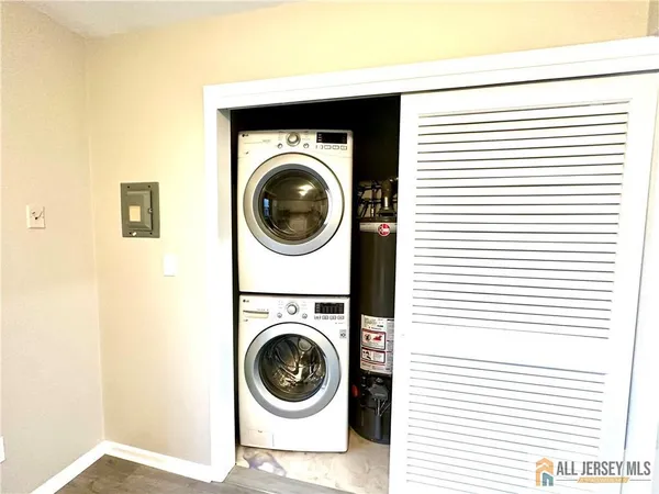 a view of a hallway with washer and dryer