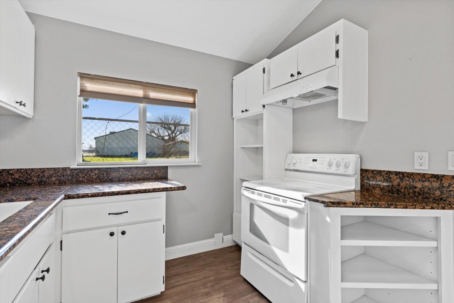 8335 Bailey Road Yuba City, CA 95993 - Photo 13 of 56 a kitchen with stainless steel appliances granite countertop a stove and a sink