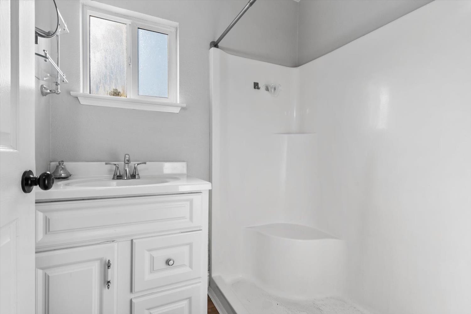 8335 Bailey Road Yuba City, CA 95993 - Photo 16 of 56 a bathroom with a sink and a mirror