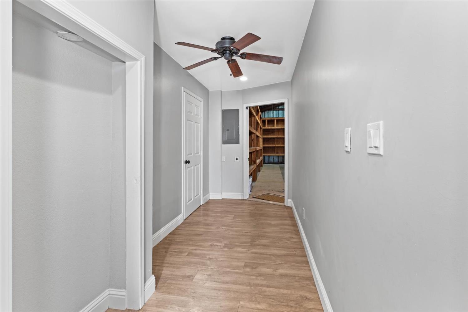 8335 Bailey Road Yuba City, CA 95993 - Photo 18 of 56 a view of a hallway with a ceiling fan