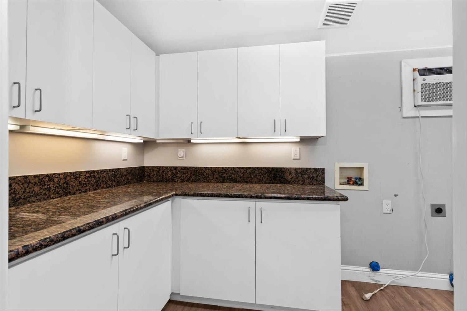 8335 Bailey Road Yuba City, CA 95993 - Photo 22 of 56 a kitchen with granite countertop a sink and a stove