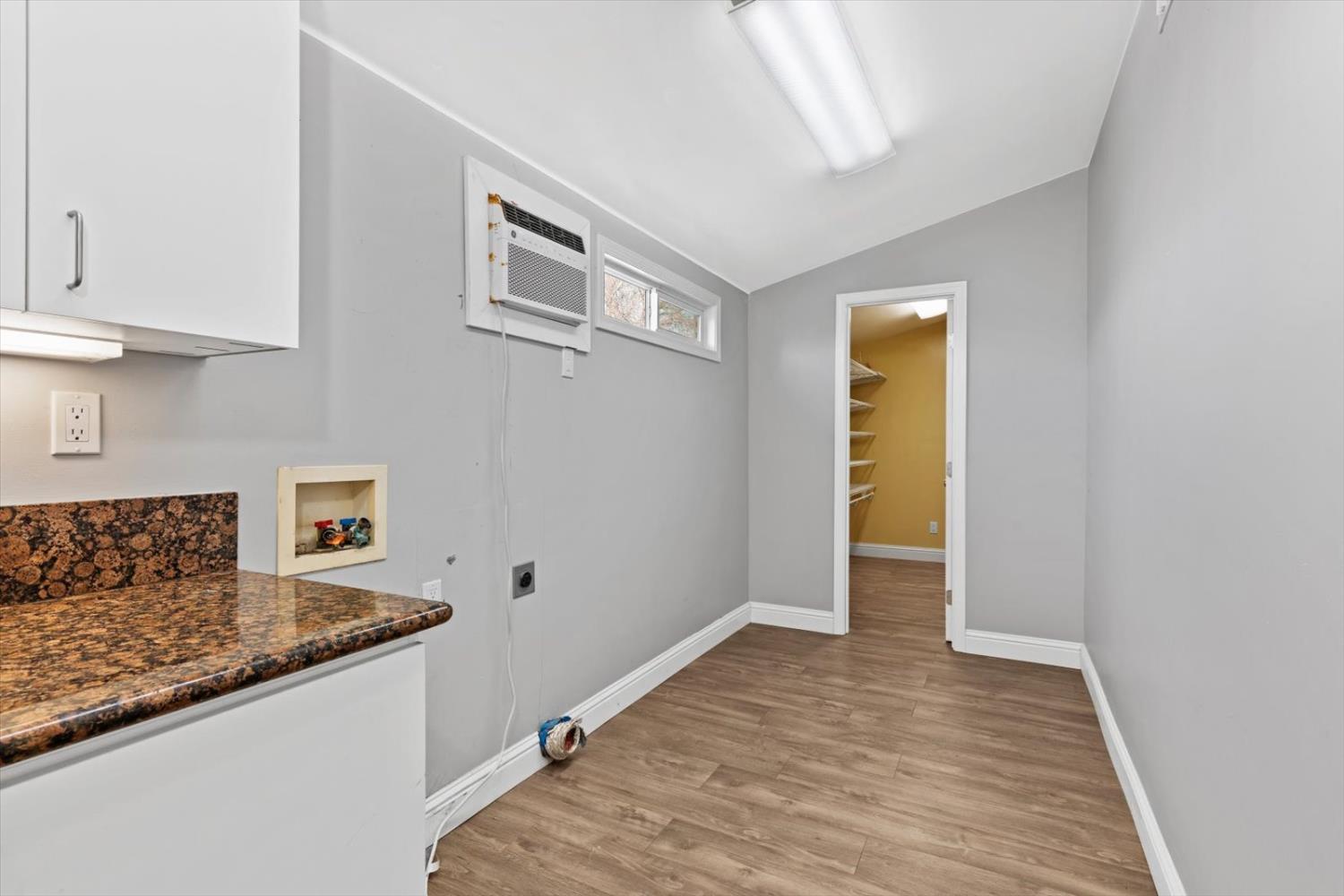 8335 Bailey Road Yuba City, CA 95993 - Photo 23 of 56 a view of a kitchen cabinets and wooden floor