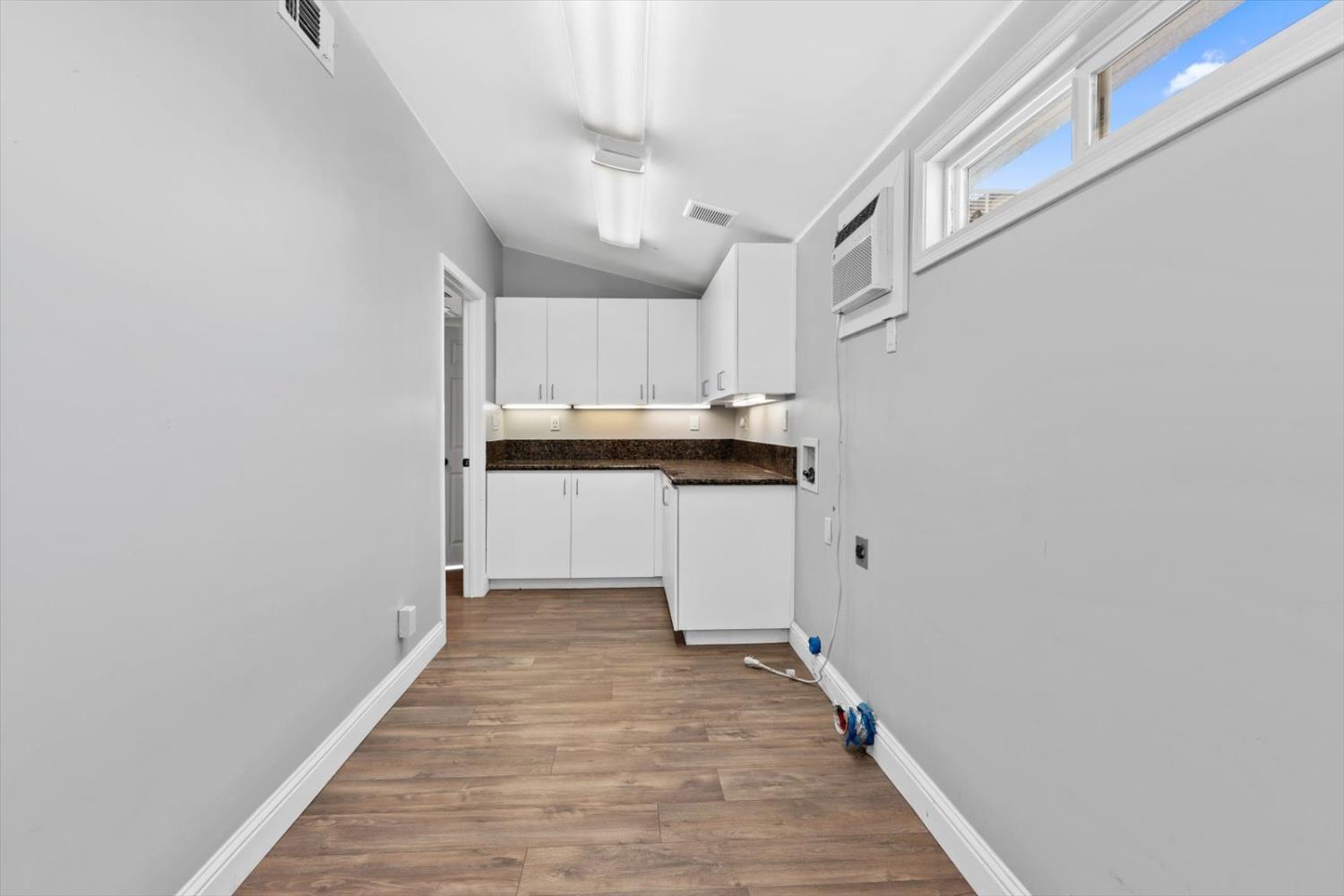 8335 Bailey Road Yuba City, CA 95993 - Photo 25 of 56 a kitchen with cabinets and wooden floor