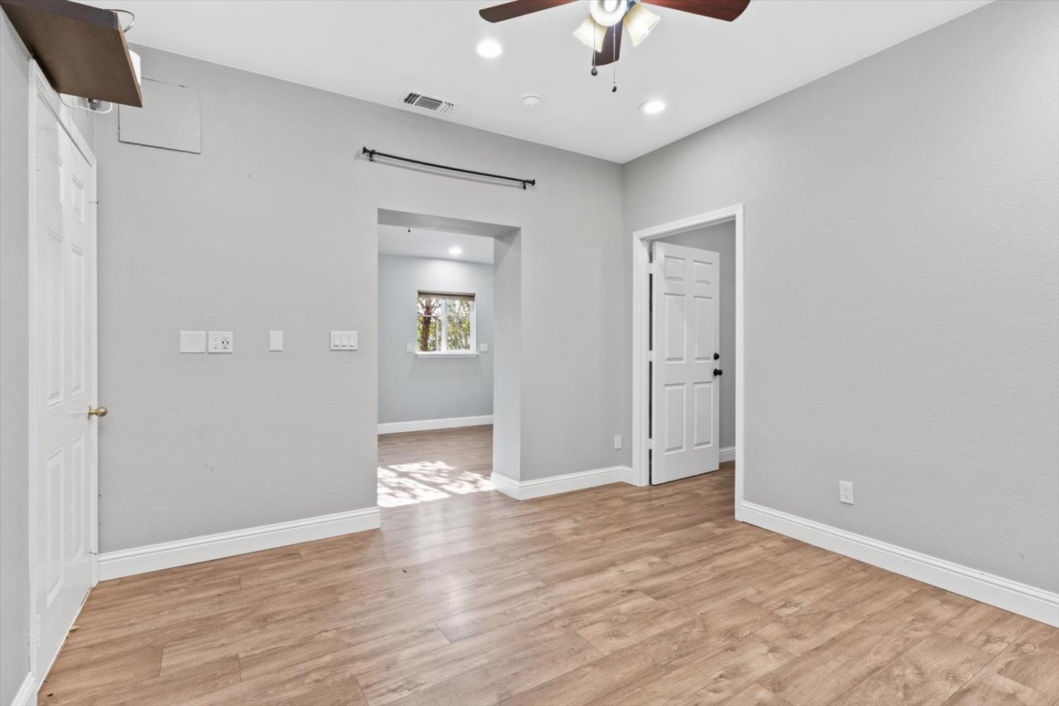 8335 Bailey Road Yuba City, CA 95993 - Photo 38 of 56 wooden floor in an empty room with a window
