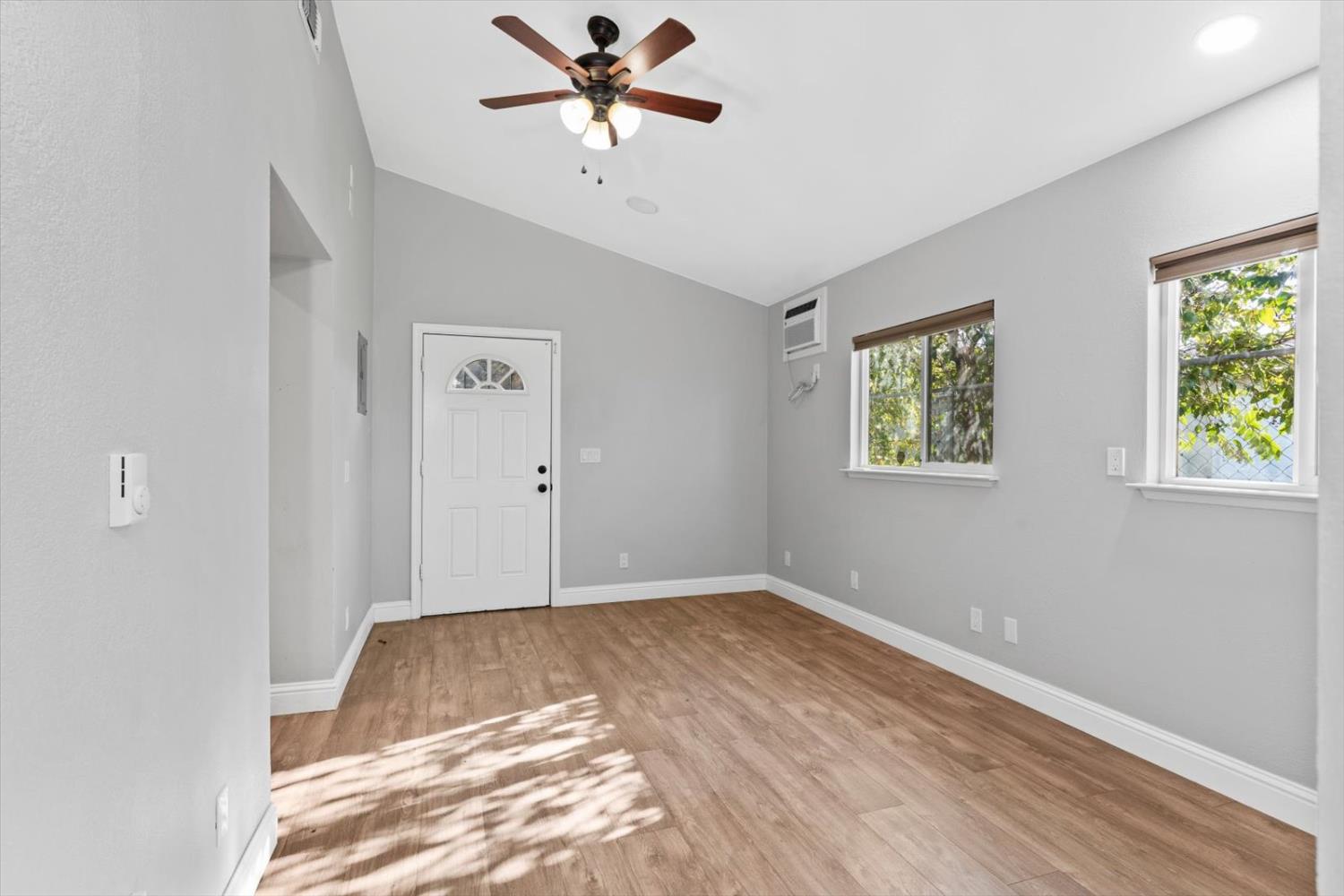 8335 Bailey Road Yuba City, CA 95993 - Photo 9 of 56 a view of a big room with wooden floor and windows