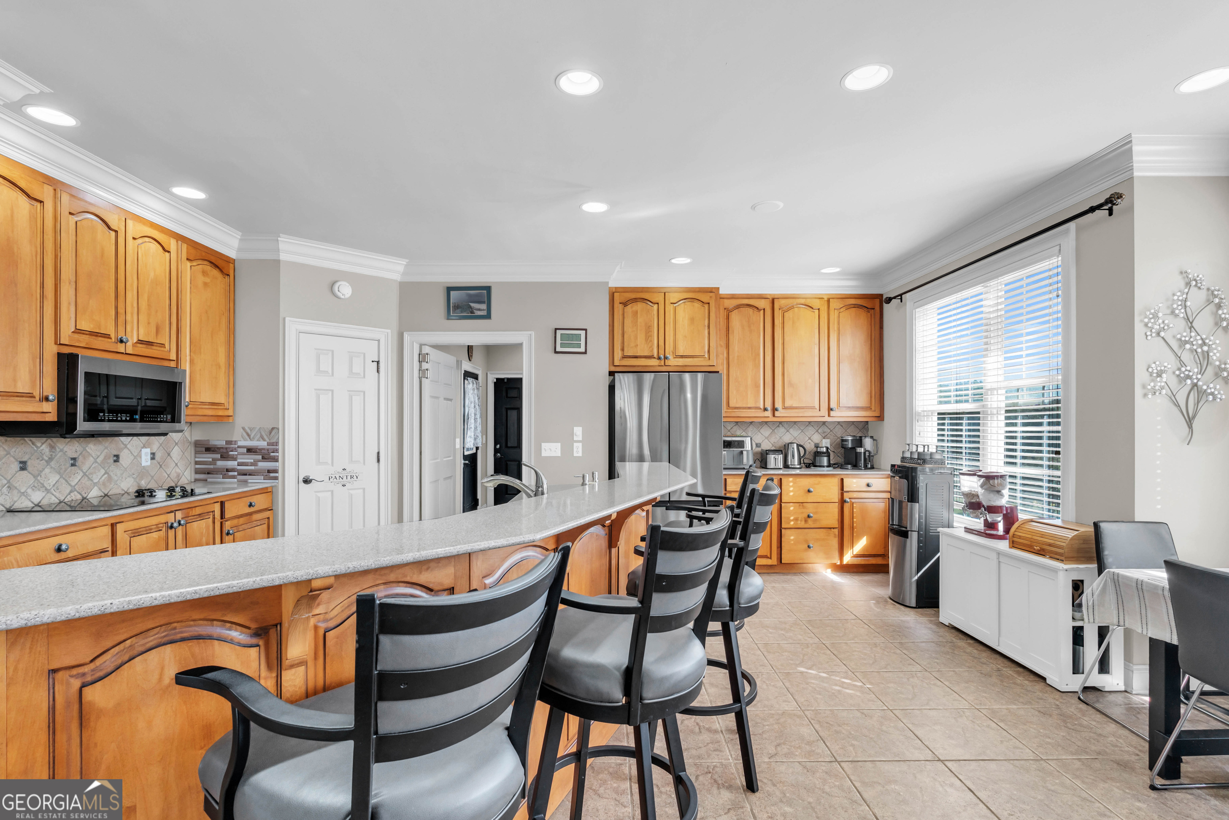 504 Ridge Pointe Lane Cohutta, GA 30710 - Photo 11 of 58 a dining room with stainless steel appliances kitchen island granite countertop furniture and a large window
