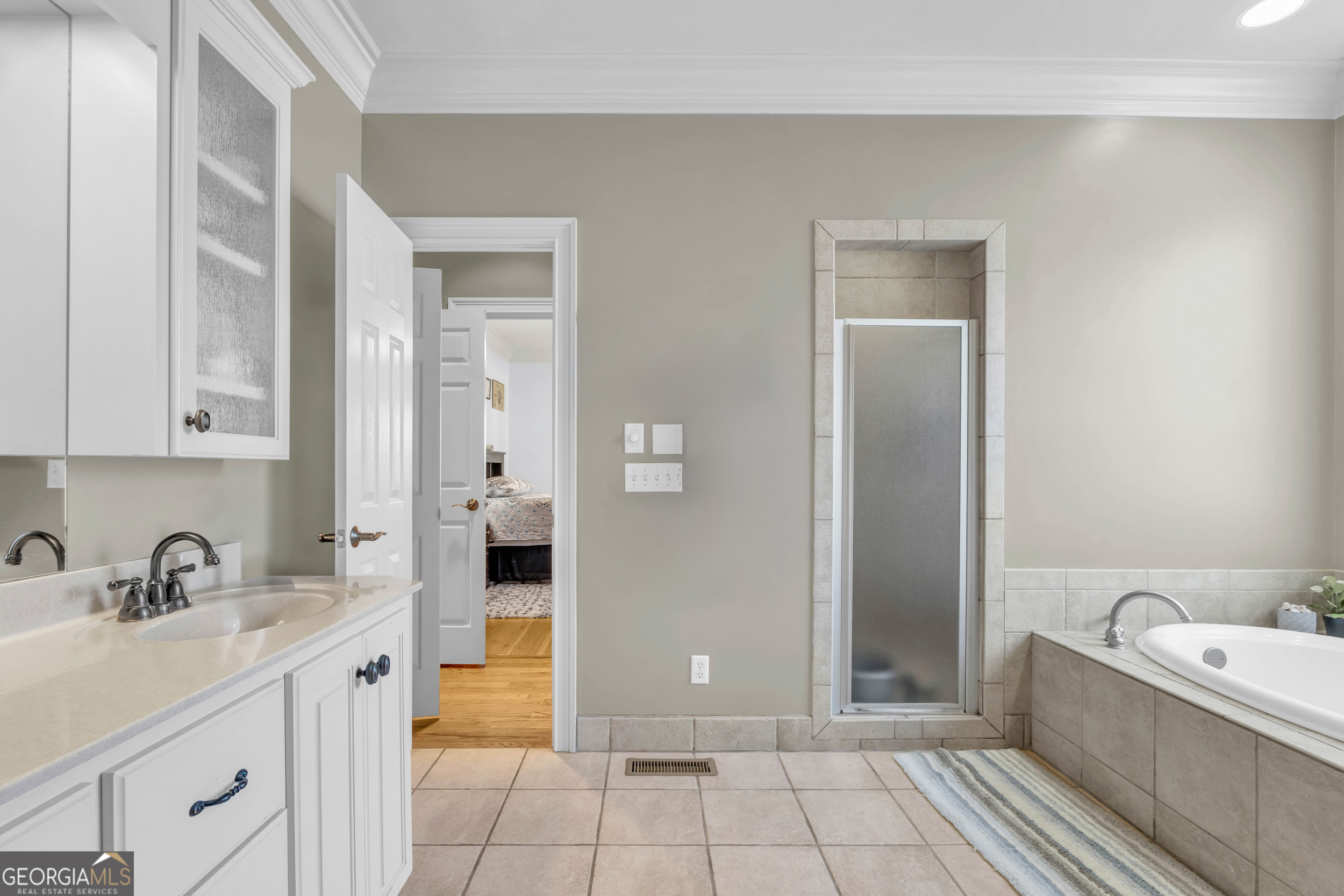 504 Ridge Pointe Lane Cohutta, GA 30710 - Photo 20 of 58 a bathroom with a tub sink and mirror