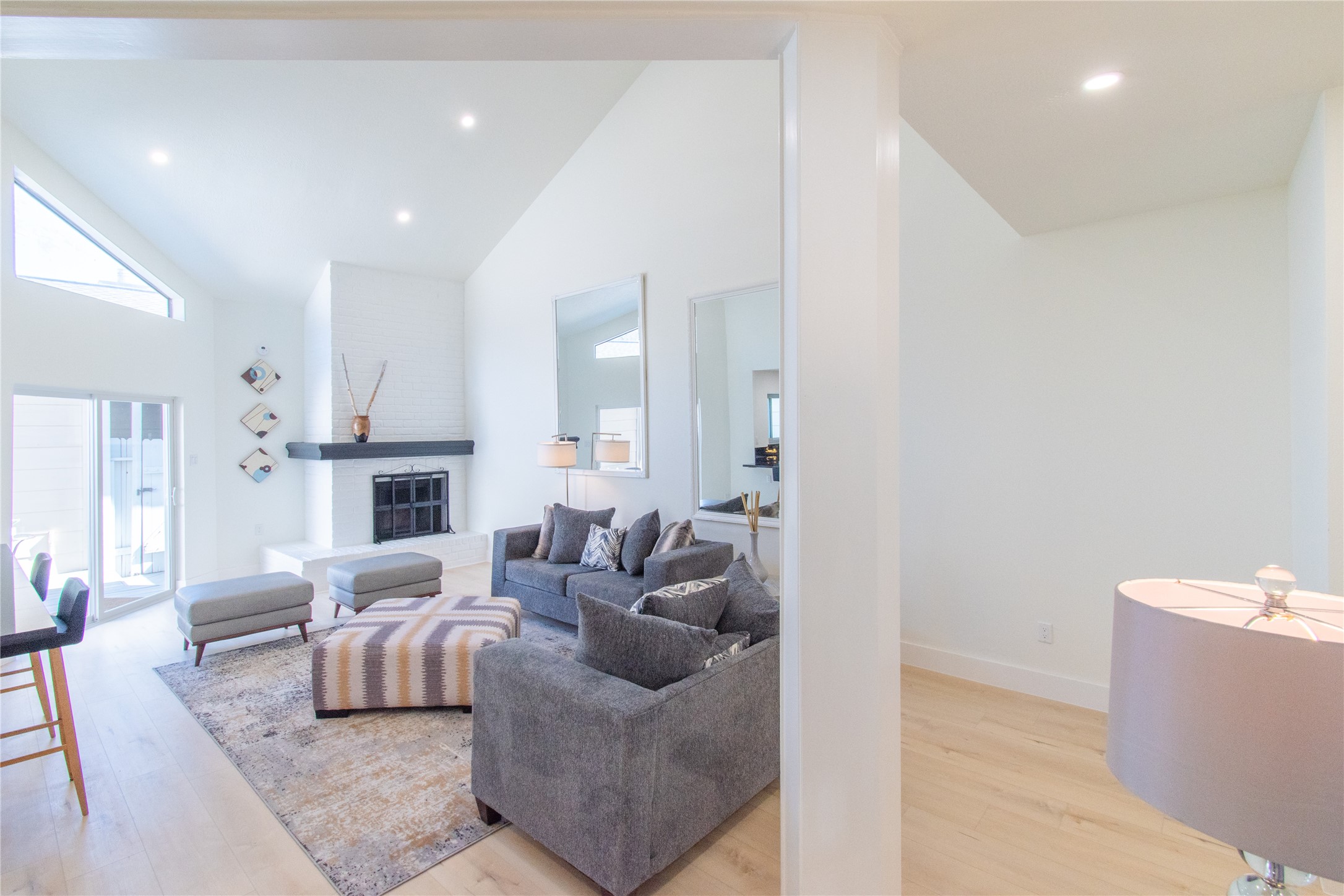 727 Bunker Hill Road, Unit 43 Houston, TX 77024 - Photo 12 of 36 a living room with furniture and a fireplace