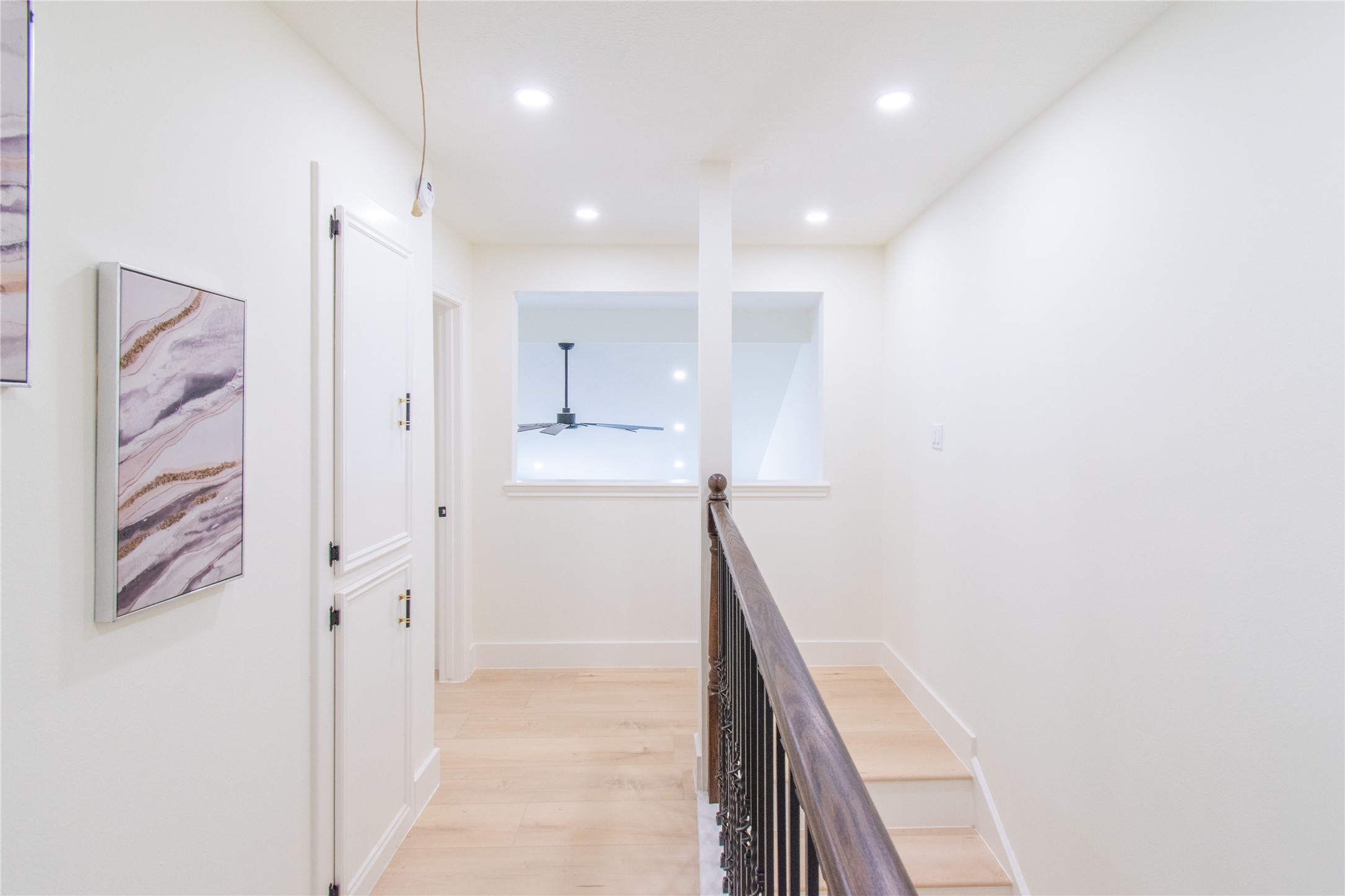 727 Bunker Hill Road, Unit 43 Houston, TX 77024 - Photo 22 of 36 a view of a hallway with closet and a window