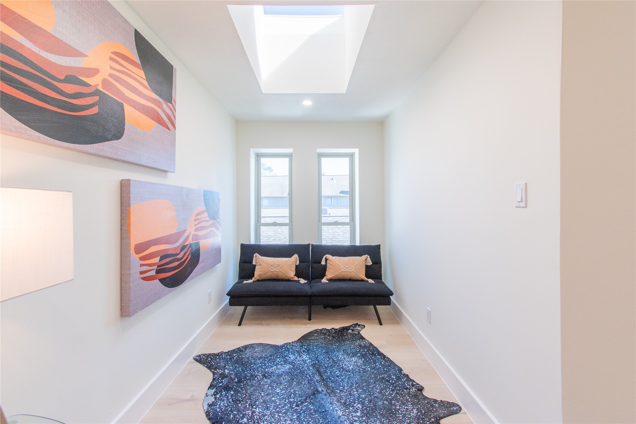 727 Bunker Hill Road, Unit 43 Houston, TX 77024 - Photo 30 of 36 a living room with furniture and a rug