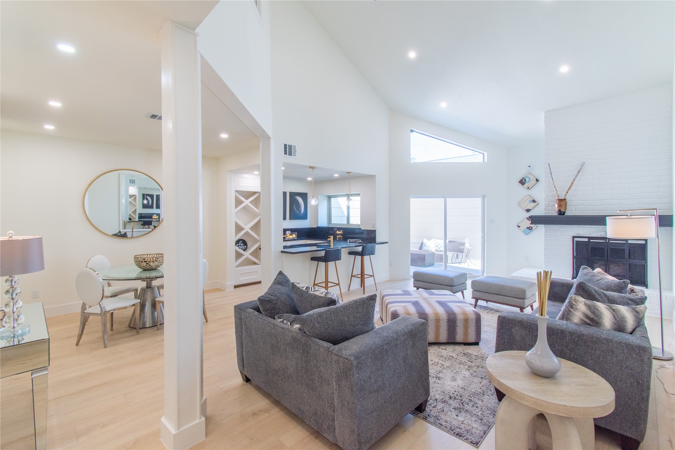 727 Bunker Hill Road, Unit 43 Houston, TX 77024 - Photo 7 of 36 a living room with furniture kitchen view and a large window