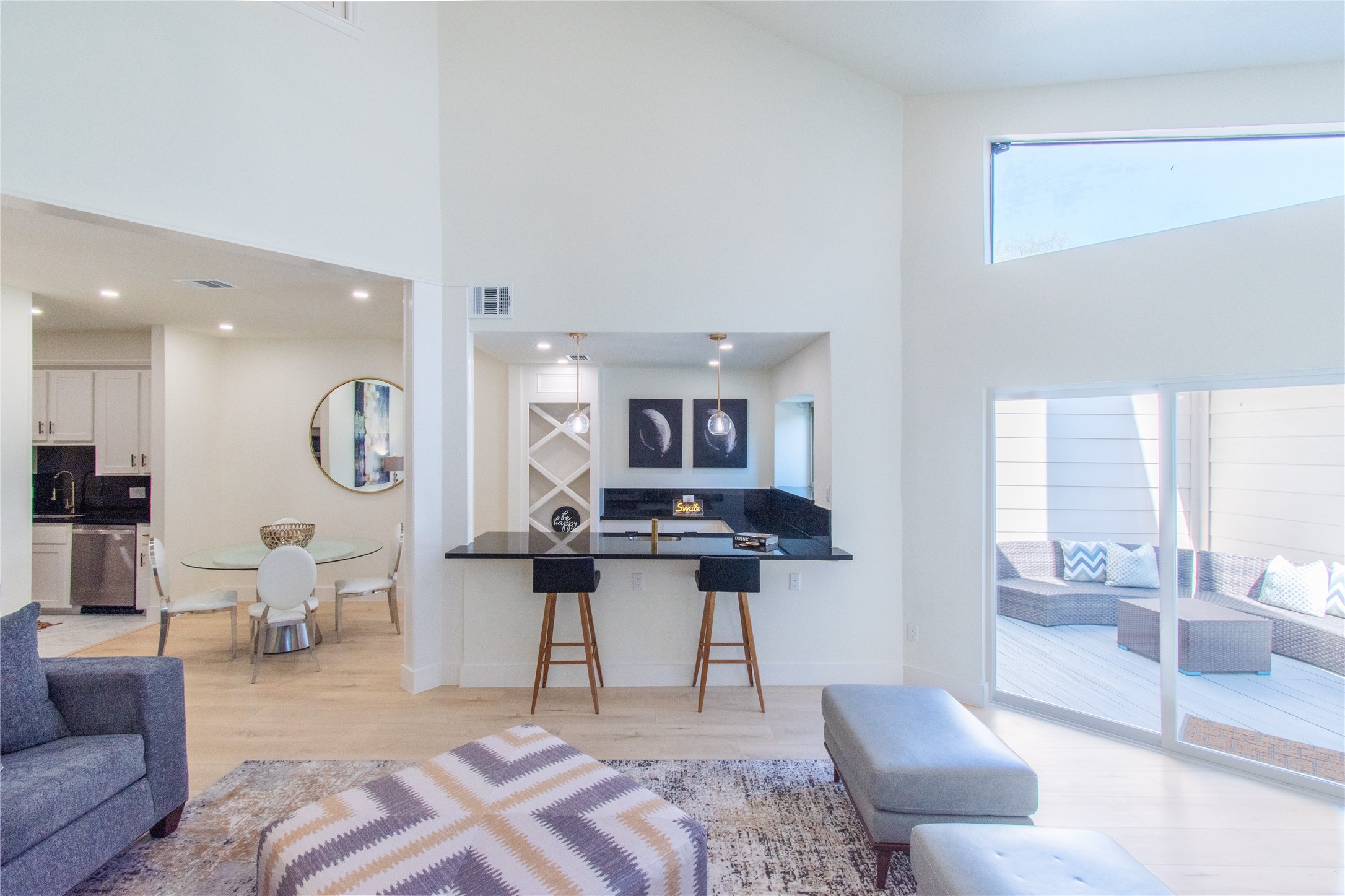 727 Bunker Hill Road, Unit 43 Houston, TX 77024 - Photo 8 of 36 a living room with furniture a rug and white walls