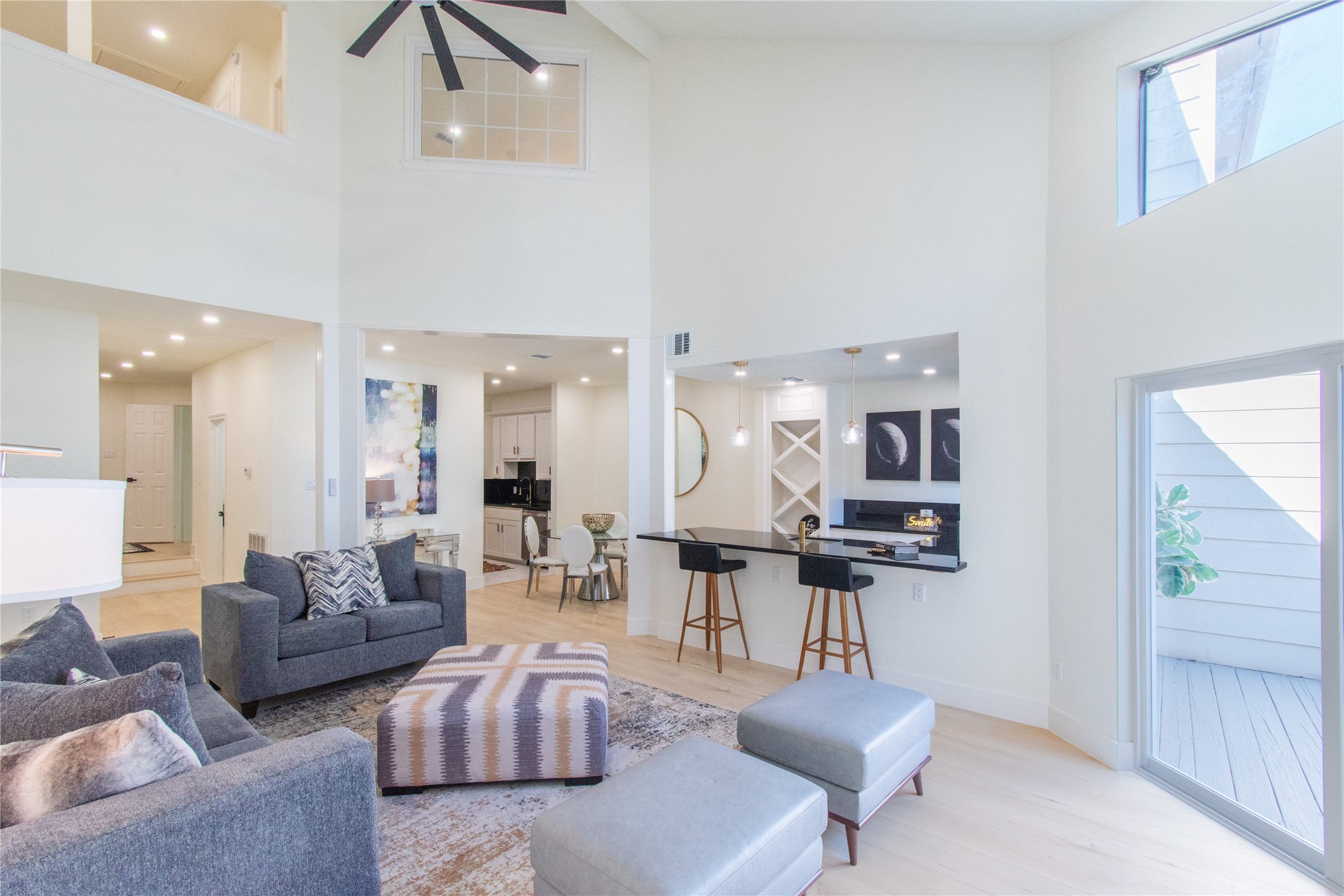 727 Bunker Hill Road, Unit 43 Houston, TX 77024 - Photo 9 of 36 a living room with furniture and wooden floor