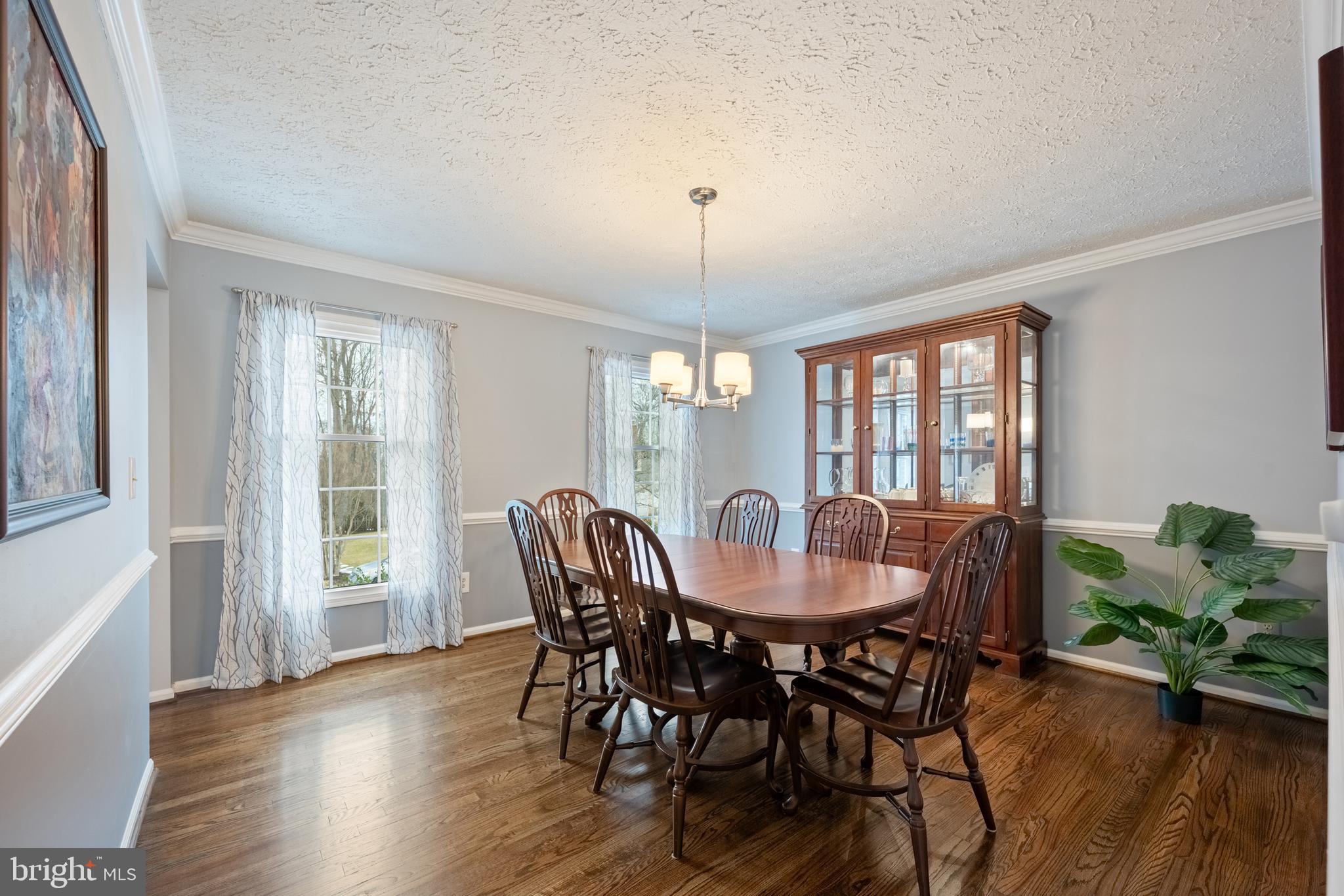 1374 Rock Chapel Road Herndon, VA 20170 - Photo 11 of 38 a view of a dining room with furniture window and wooden floor