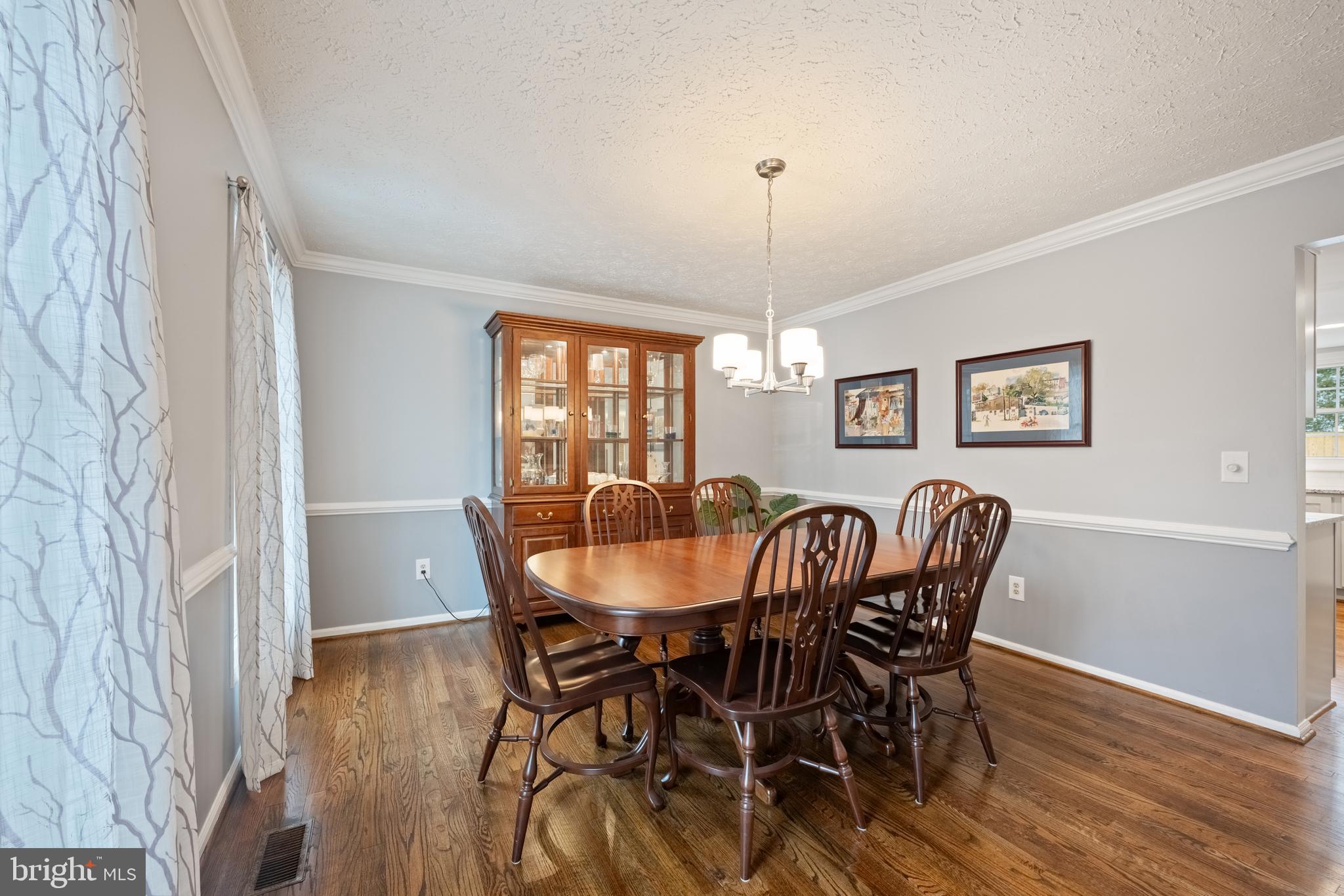 1374 Rock Chapel Road Herndon, VA 20170 - Photo 12 of 38 a view of a dining room with furniture window and wooden floor