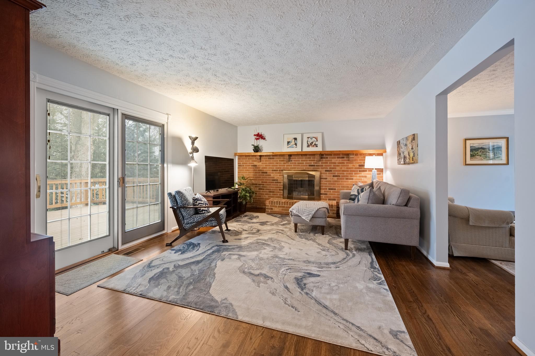 1374 Rock Chapel Road Herndon, VA 20170 - Photo 14 of 38 a living room with furniture and a flat screen tv