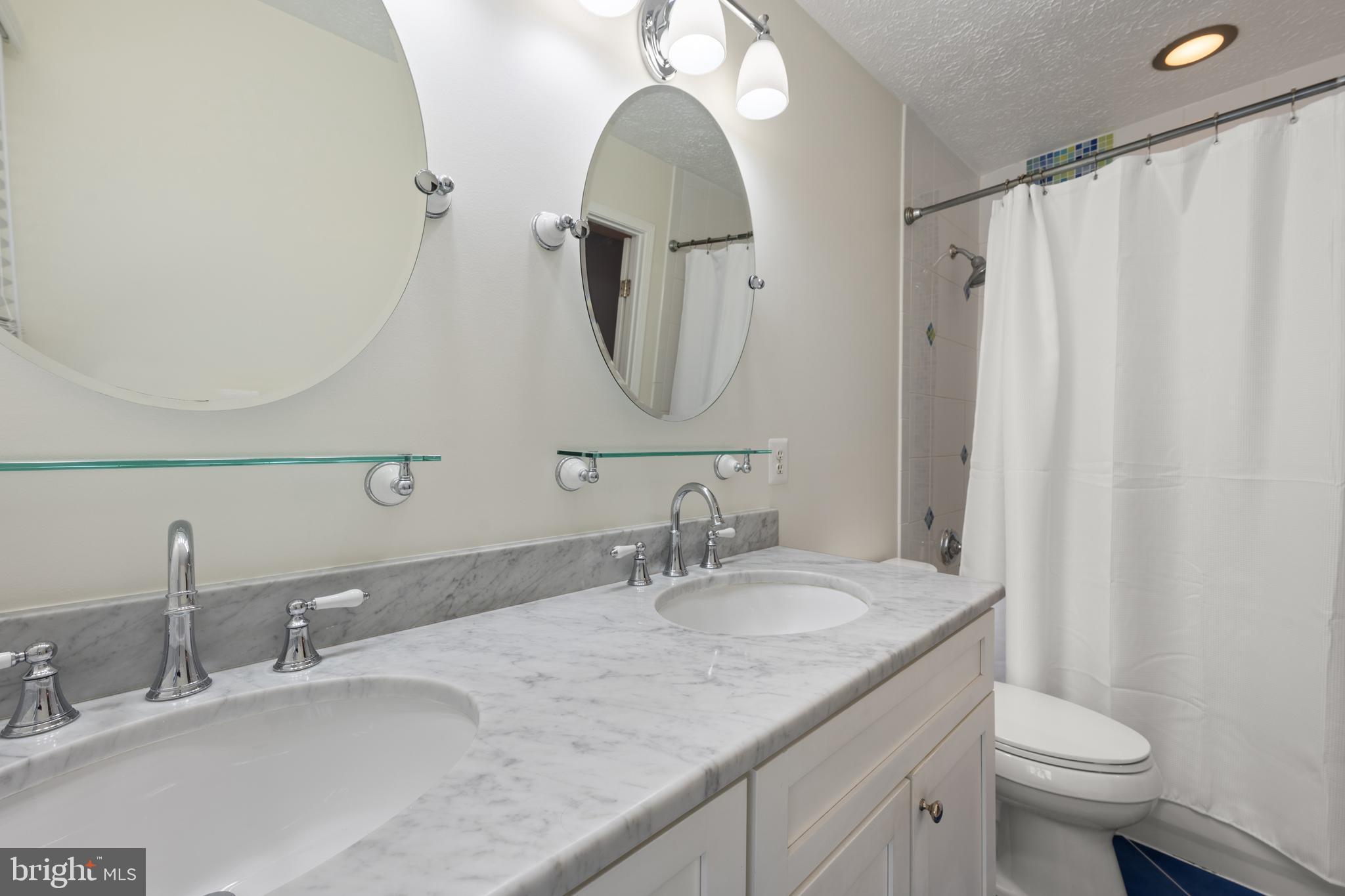 1374 Rock Chapel Road Herndon, VA 20170 - Photo 19 of 38 a bathroom with a granite countertop sink and a mirror