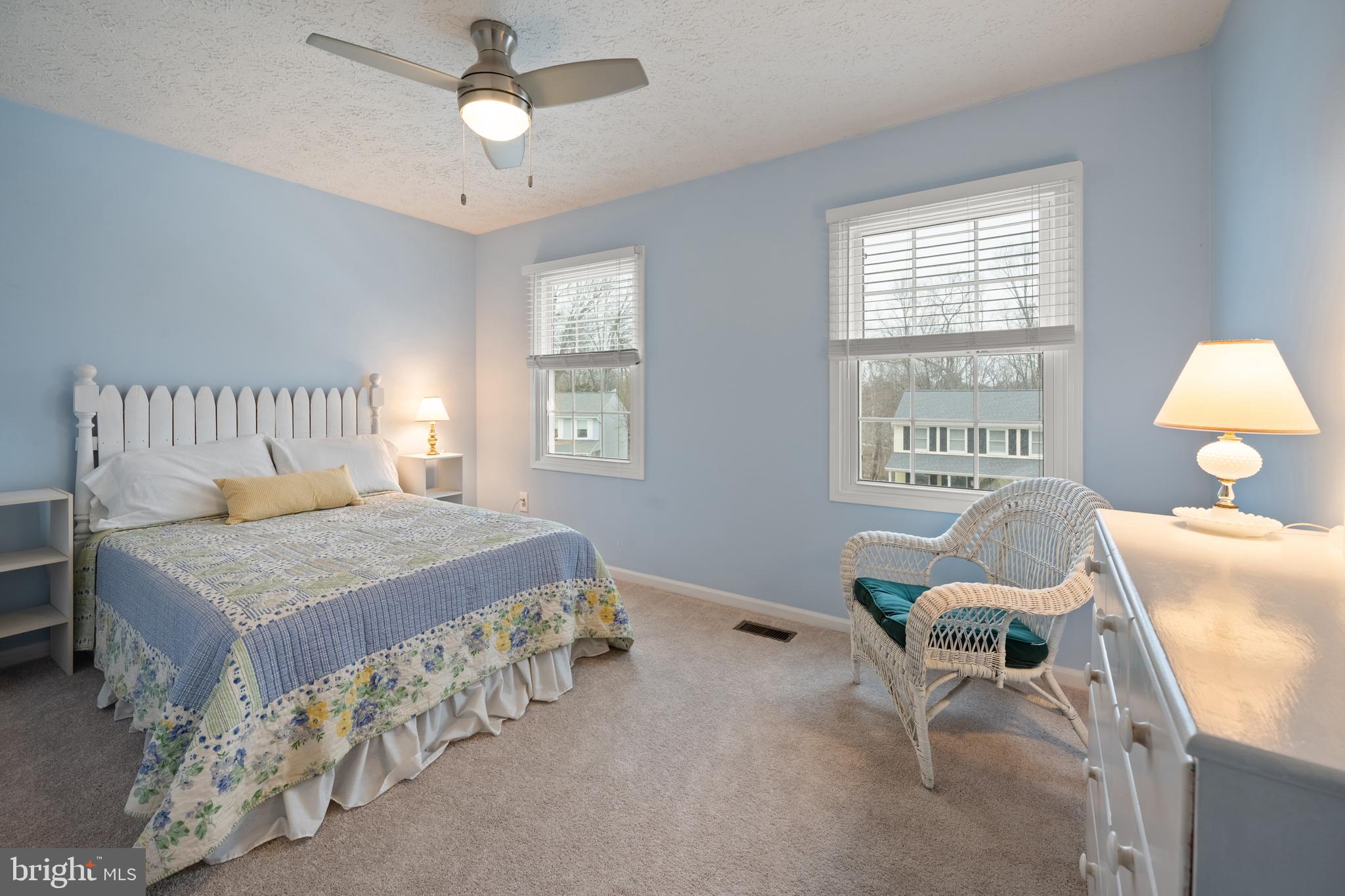 1374 Rock Chapel Road Herndon, VA 20170 - Photo 20 of 38 a bedroom with a bed and a chandelier