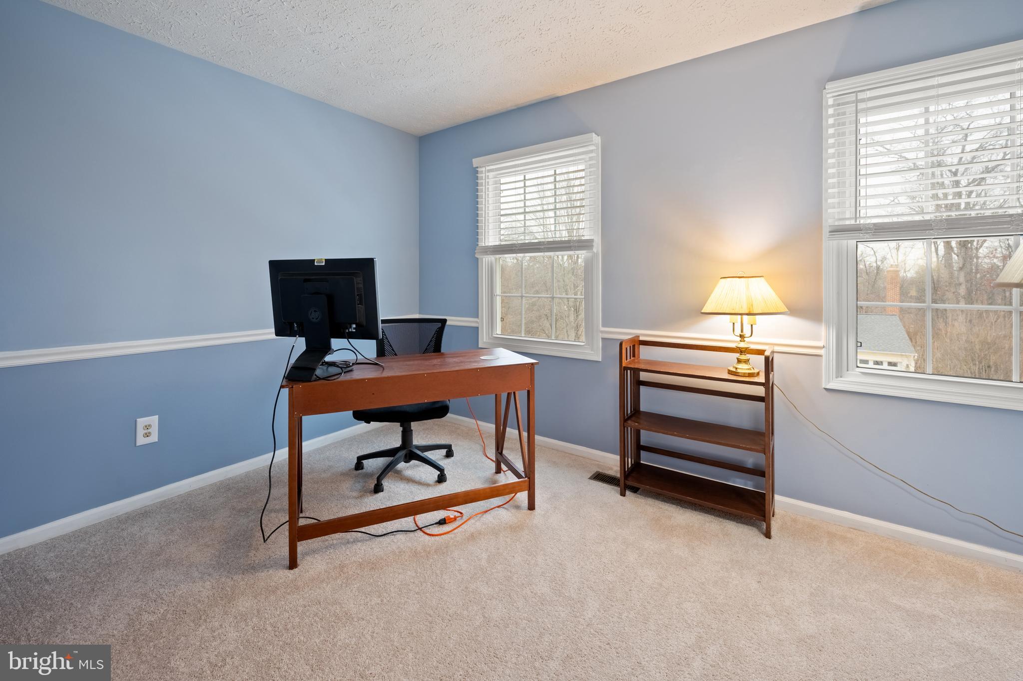 1374 Rock Chapel Road Herndon, VA 20170 - Photo 22 of 38 a view of a workspace with furniture and a window