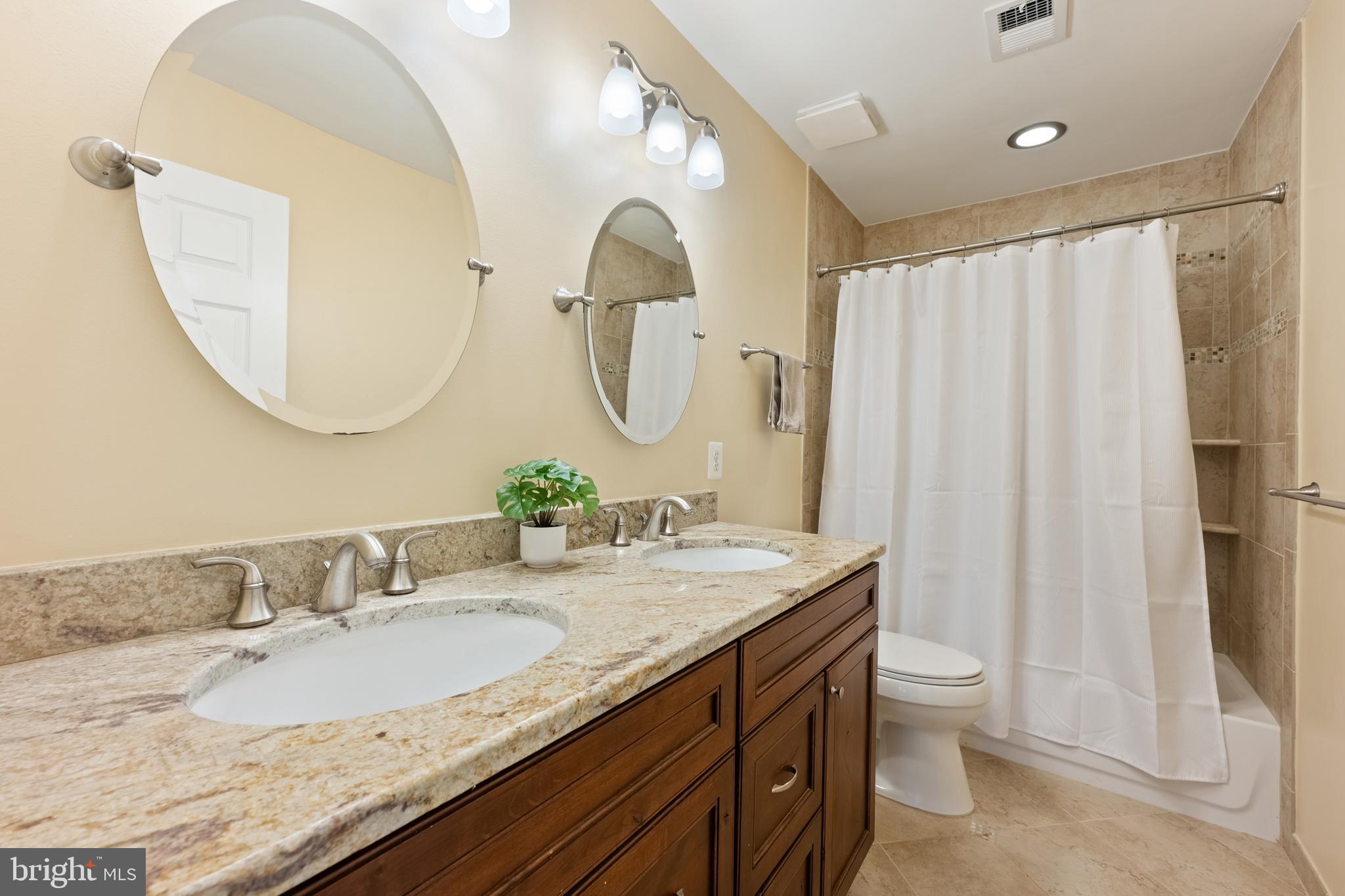 1374 Rock Chapel Road Herndon, VA 20170 - Photo 29 of 38 a bathroom with a granite countertop sink and a mirror