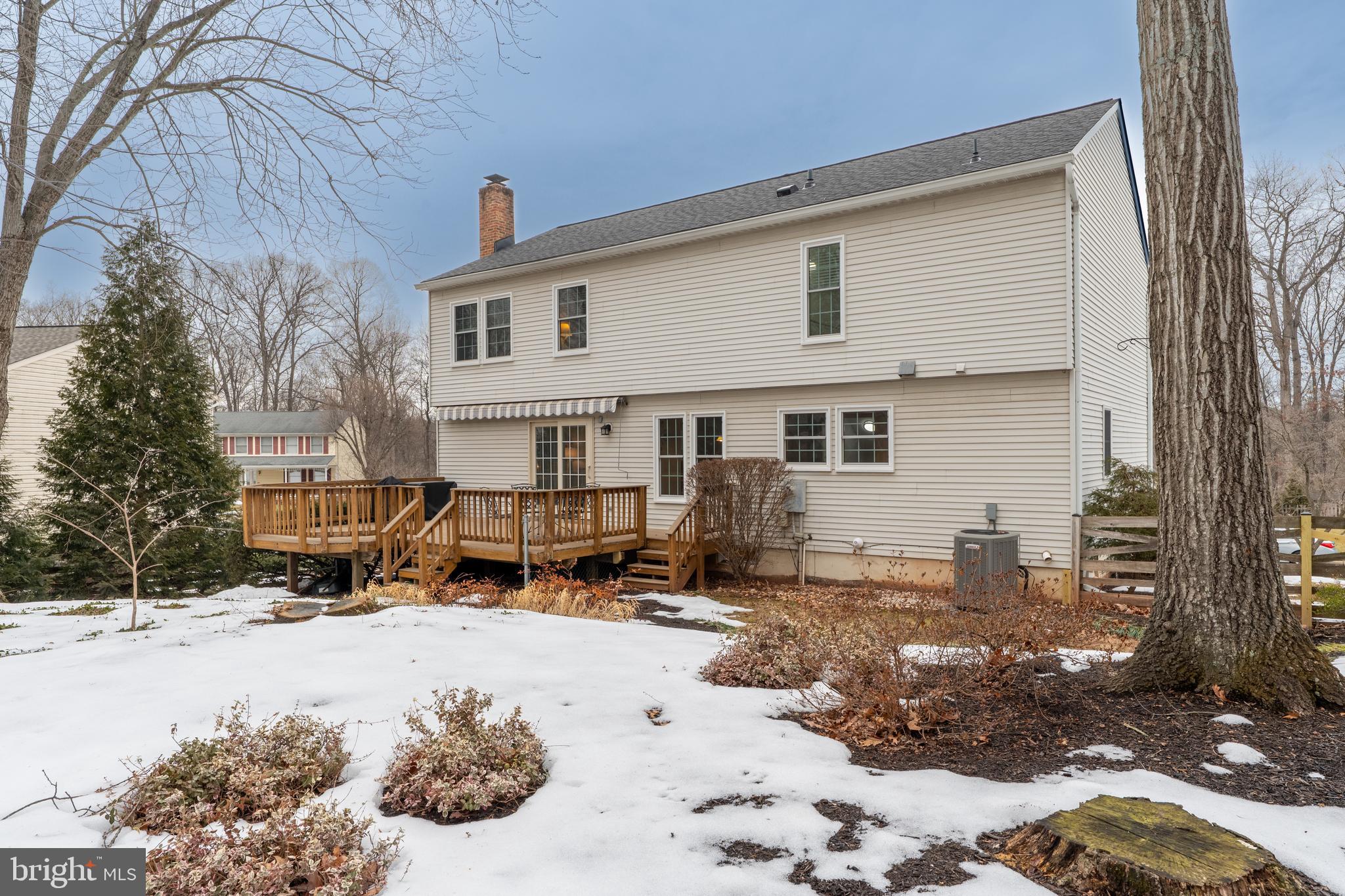 1374 Rock Chapel Road Herndon, VA 20170 - Photo 38 of 38 a front view of a house with a yard covered in snow