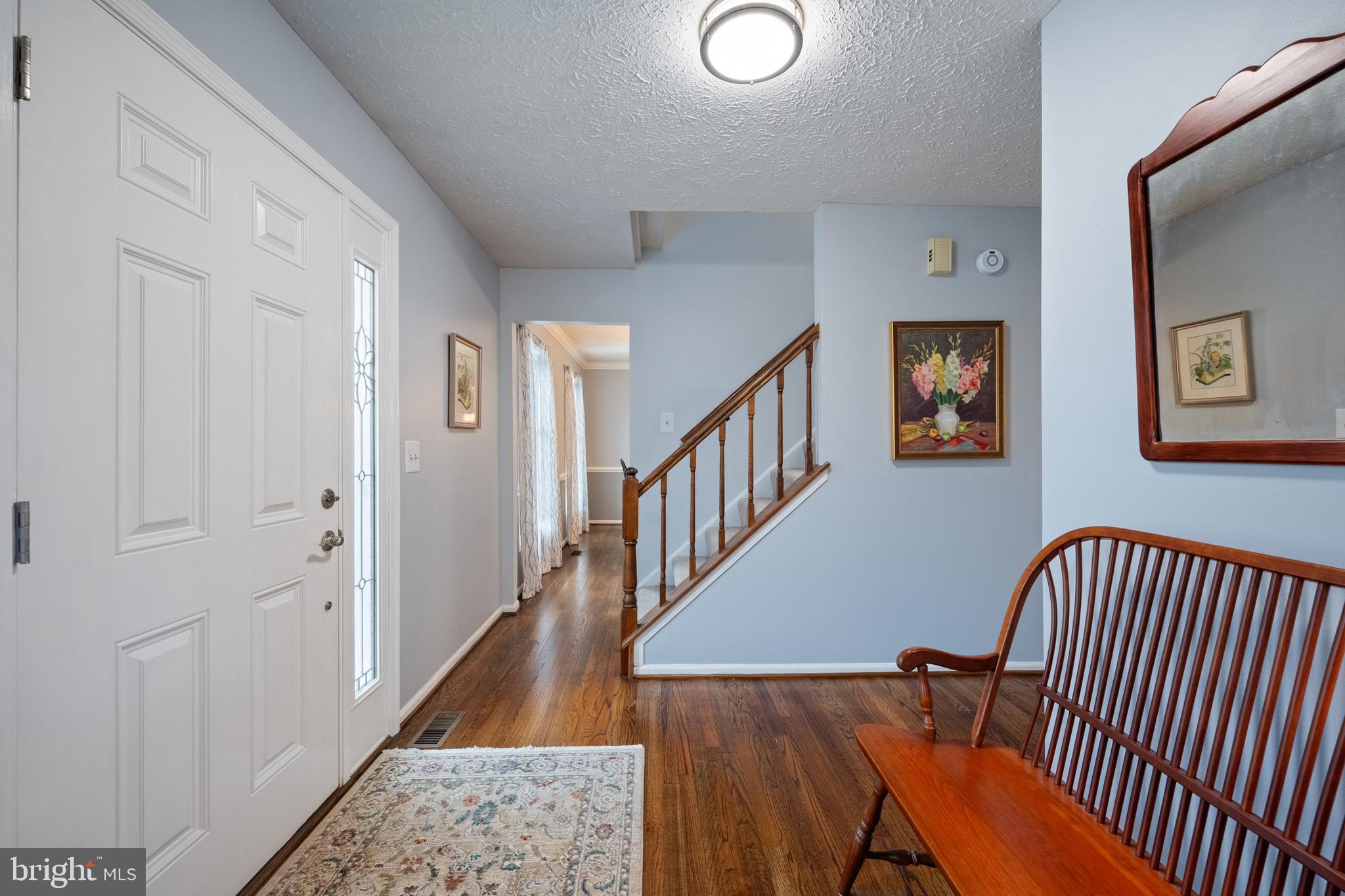 1374 Rock Chapel Road Herndon, VA 20170 - Photo 4 of 38 a view of staircase with lots of frames on wall and a window