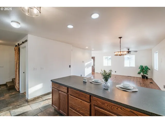 a view of a center island kitchen island furniture and windows