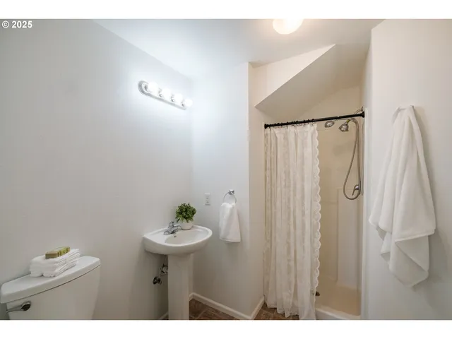 a bathroom with a sink vanity and a mirror