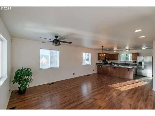 a view of kitchen and kitchen with microwave