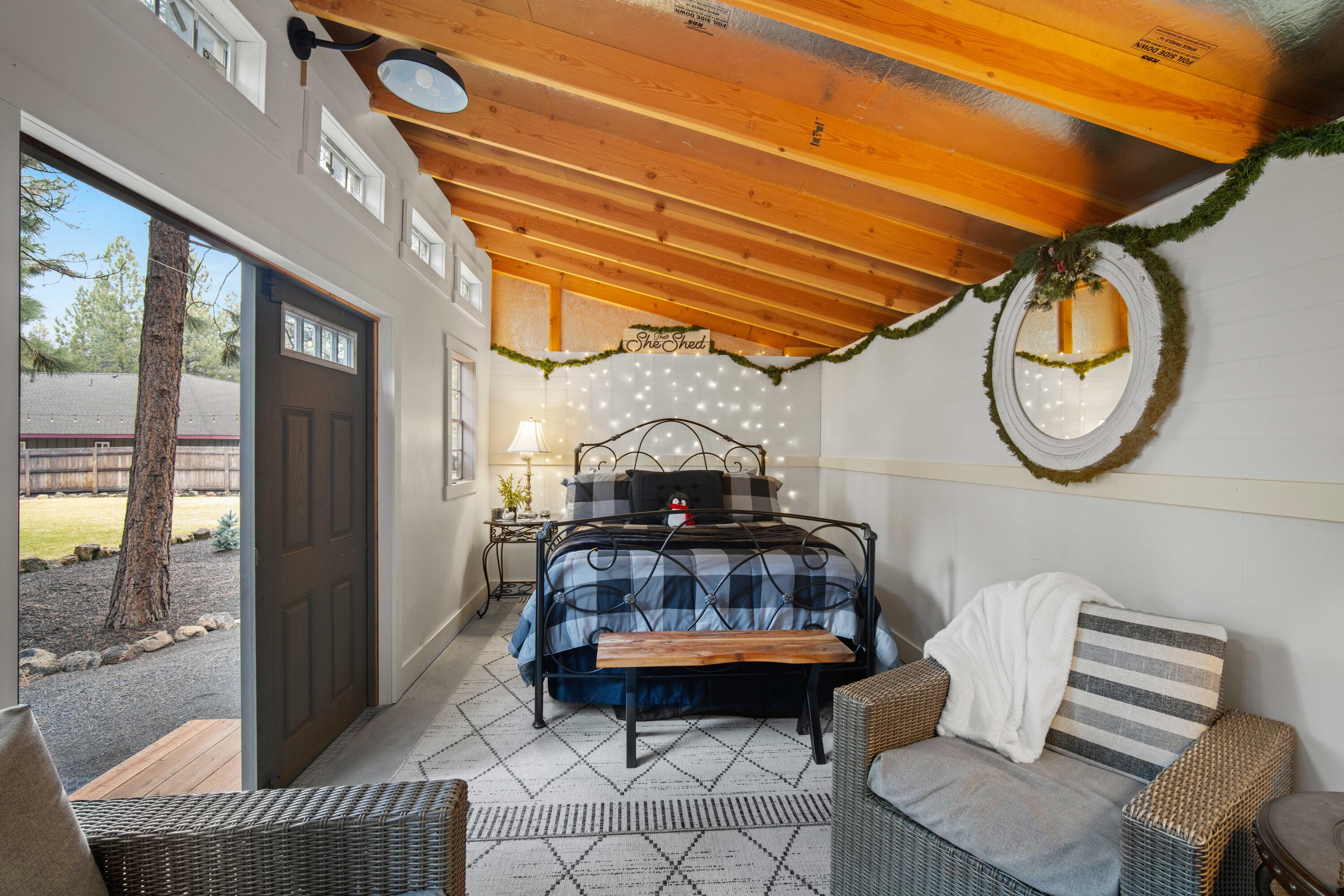 16927 Covina Road Bend, OR 97707 - Photo 46 of 54 Finished backyard flex space with electricity and a warm, welcoming feel, thoughtfully designed as a peaceful retreat within the property?s oasis-like outdoor environment.