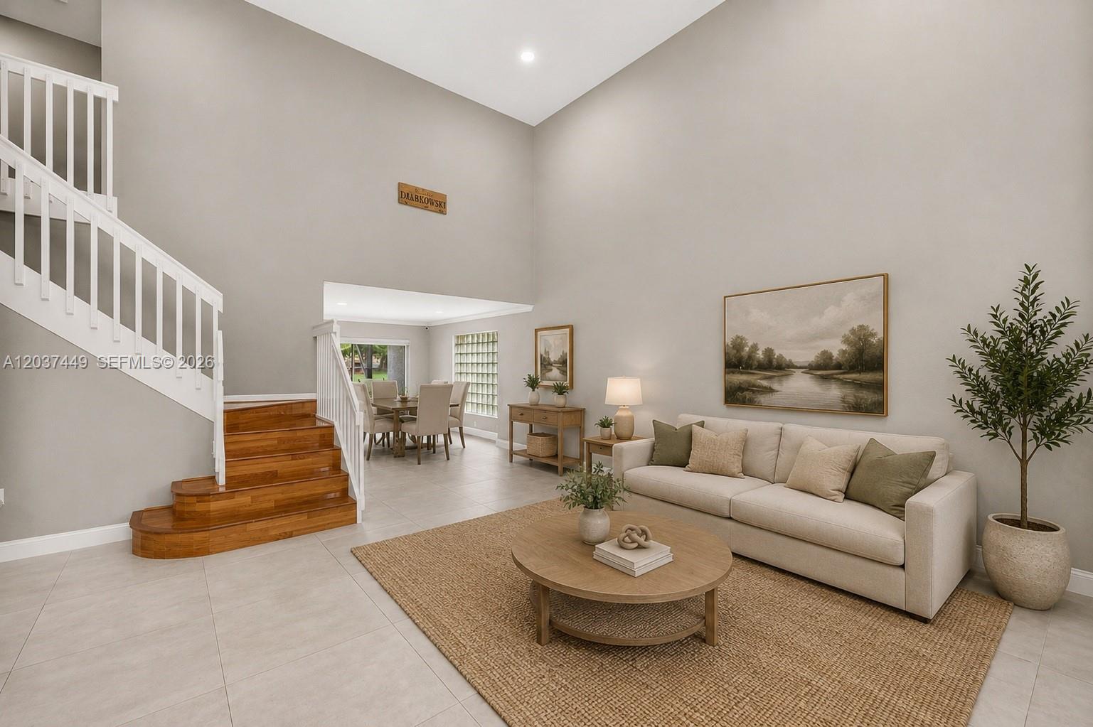 17488 Southwest 28th Court Miramar, FL 33029 - Photo 7 of 50 a living room with furniture and a table