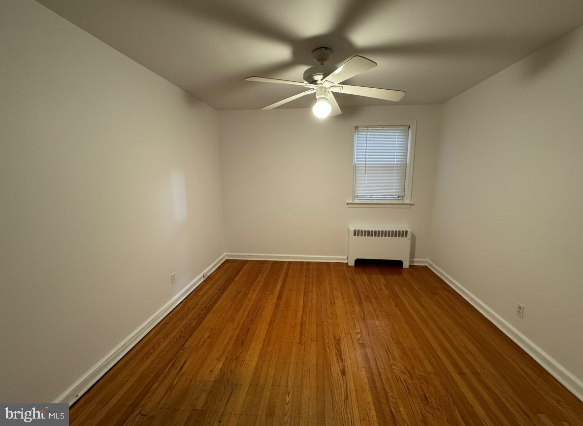 206-212 Clements Bridge Road, Unit 2 Barrington, NJ 08007 - Photo 4 of 5 a view of a room with wooden floor and fan