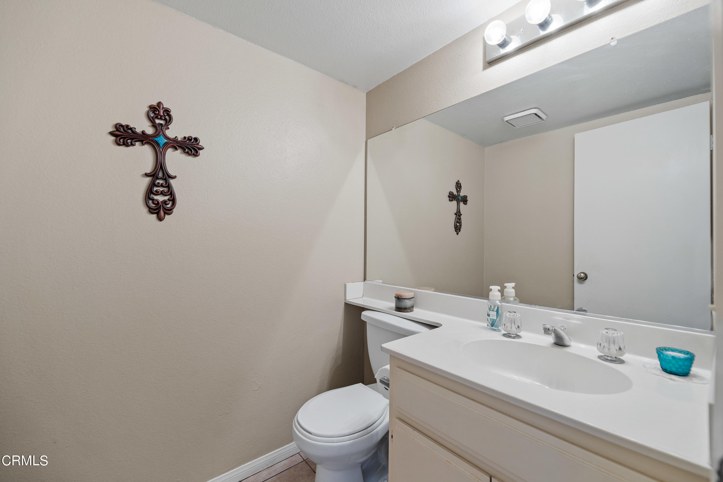 3554 Olds Road Oxnard, CA 93033 - Photo 13 of 27 a bathroom with a sink a toilet and a mirror