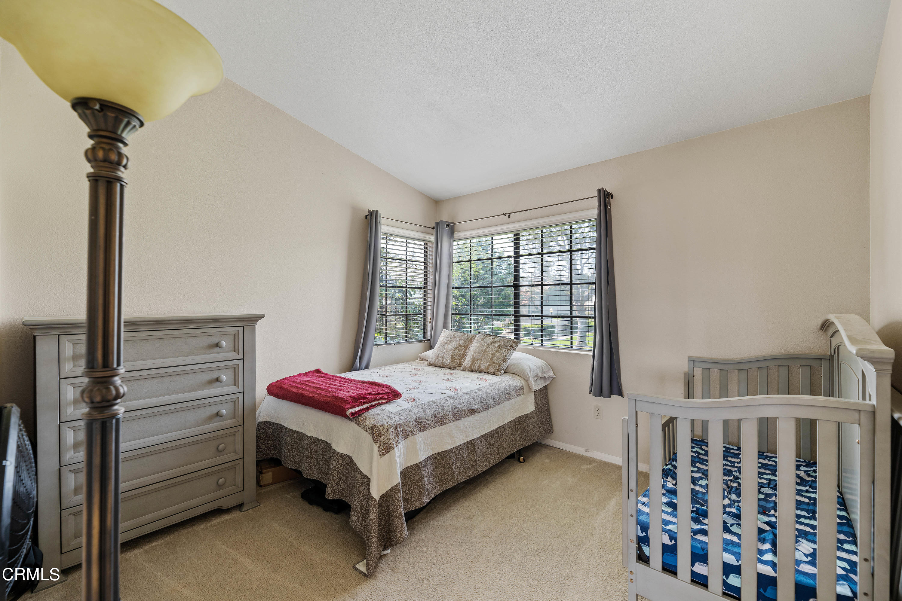 3554 Olds Road Oxnard, CA 93033 - Photo 19 of 27 a bedroom with a bed table and a window