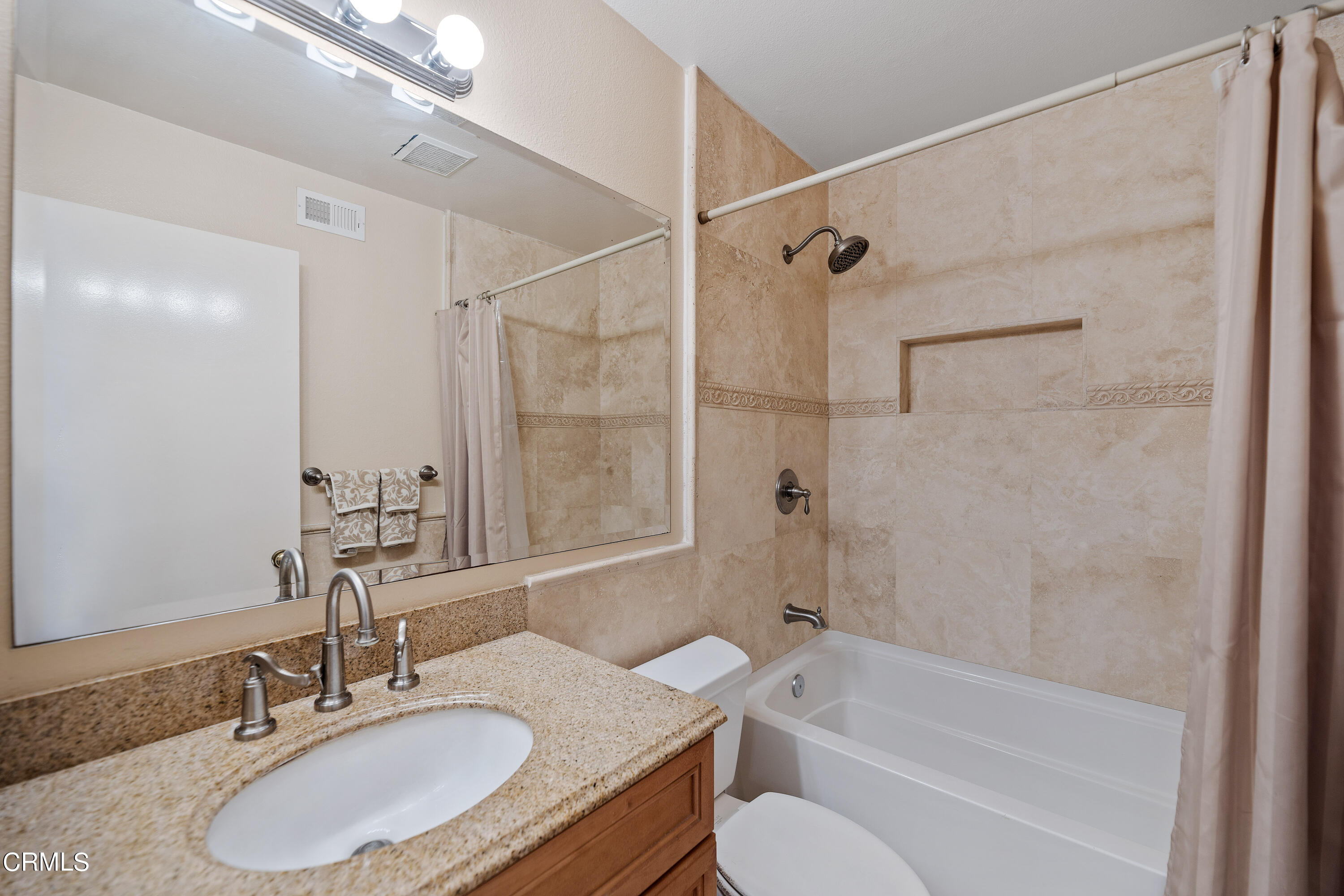 3554 Olds Road Oxnard, CA 93033 - Photo 20 of 27 a bathroom with a granite countertop sink toilet tub and shower