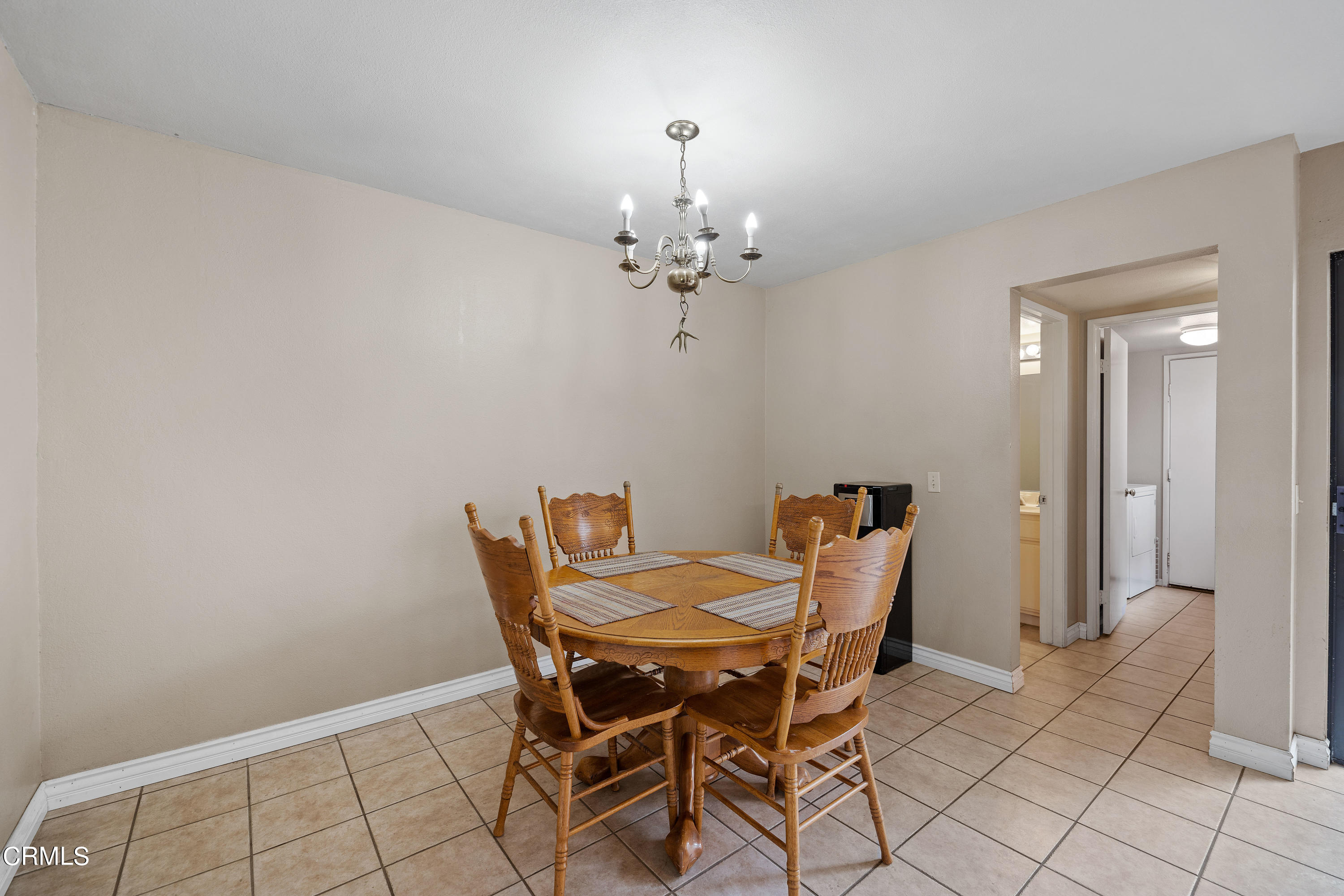 3554 Olds Road Oxnard, CA 93033 - Photo 8 of 27 a view of a dining room with furniture and chandelier