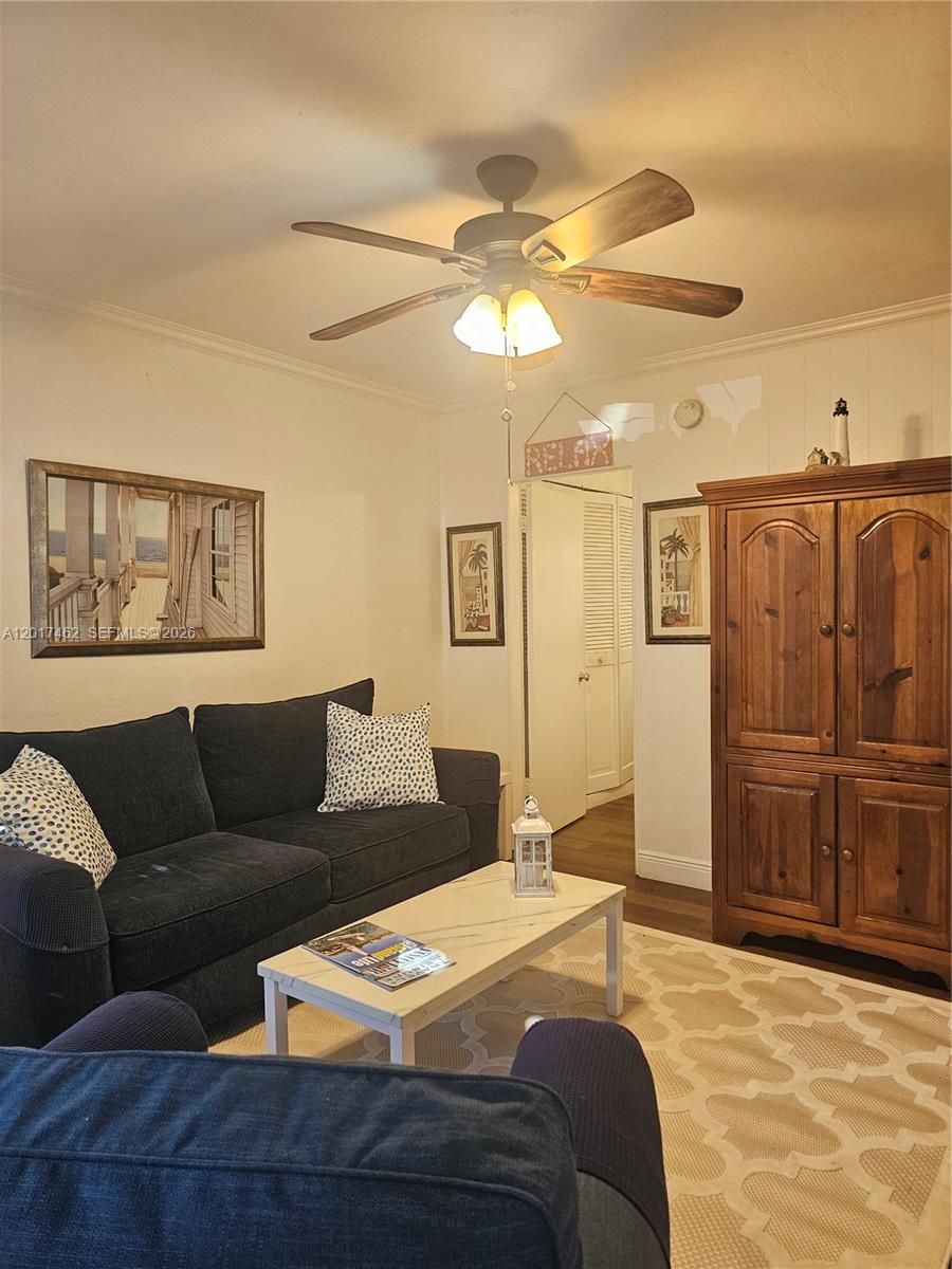 325 Fernwood Road, Unit 10 Key Biscayne, FL 33149 - Photo 5 of 12 a bedroom with a bed window and couch