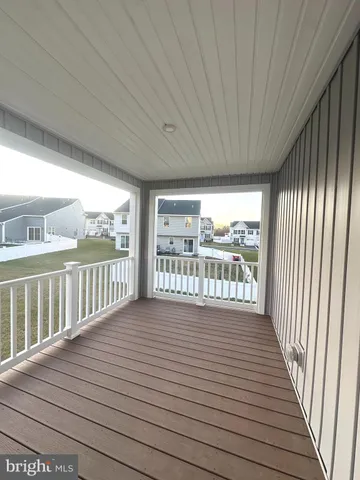 a view of balcony with wooden floor