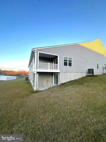 a view of a big house with a big yard