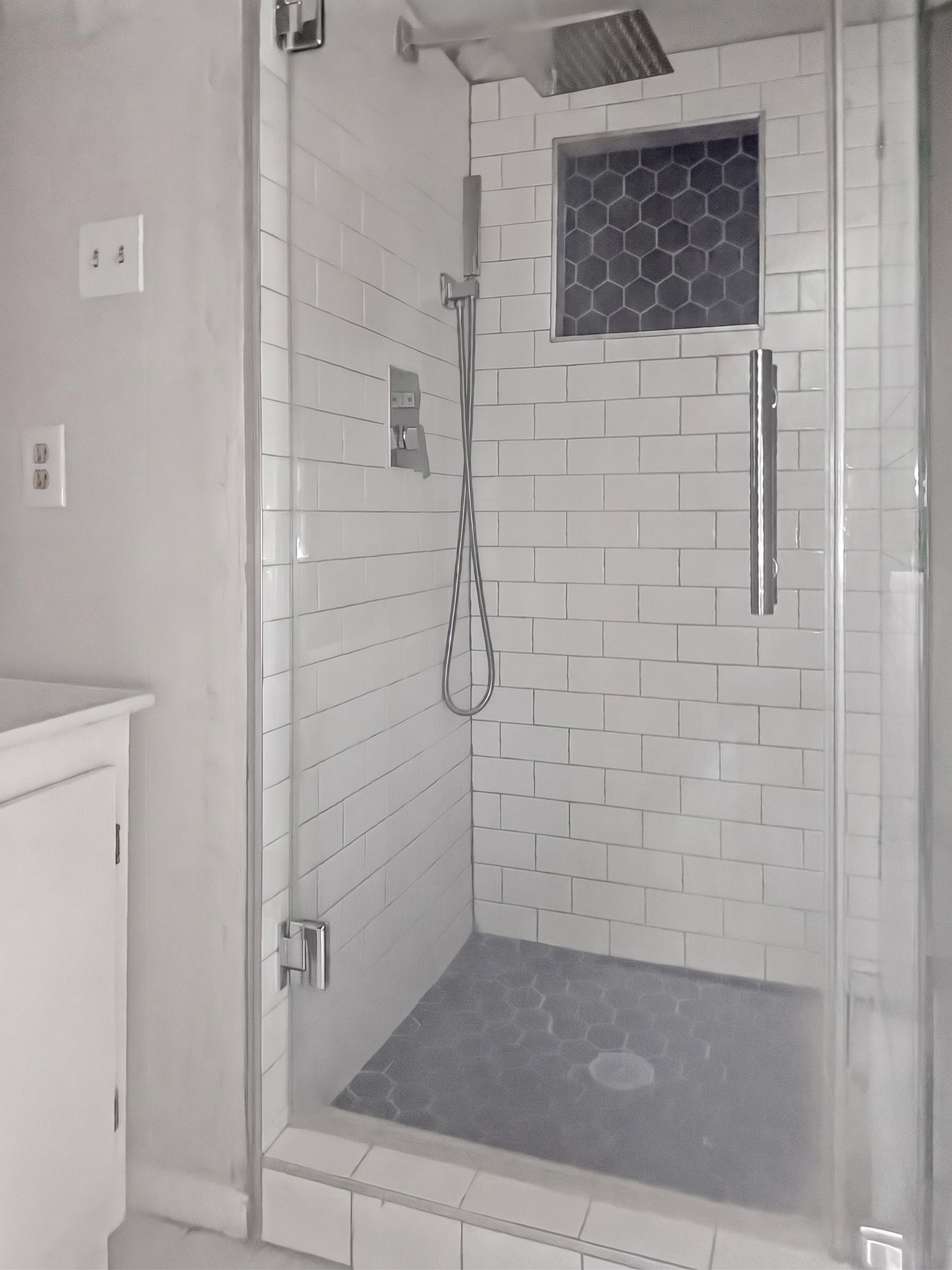 2313 Avenue L Rosenberg, TX 77471 - Photo 26 of 31 Alternate view of the beautifully renovated walk-in shower showcasing the frameless glass door and stylish tile finishes.