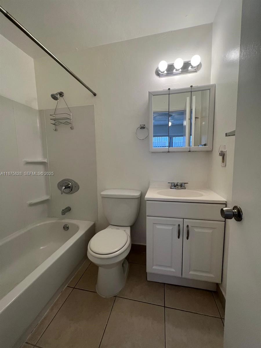 1670 Harding Street Hollywood, FL 33020 - Photo 12 of 19 a bathroom with a sink a toilet and shower