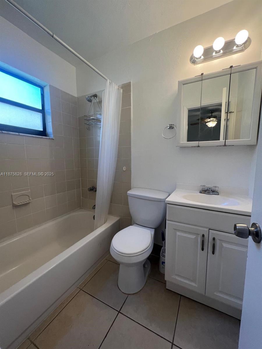 1670 Harding Street Hollywood, FL 33020 - Photo 13 of 19 a bathroom with a sink toilet vanity and bathtub