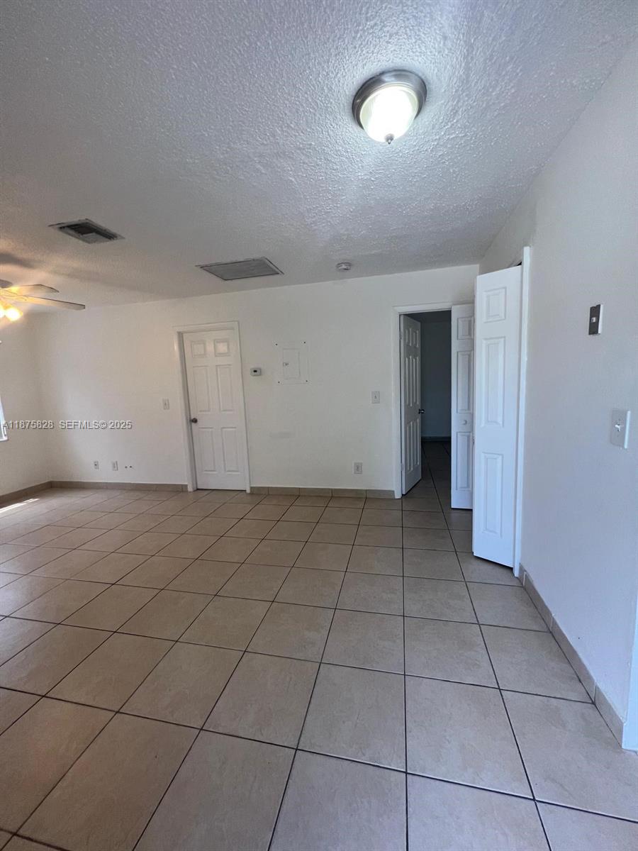 1670 Harding Street Hollywood, FL 33020 - Photo 15 of 19 a view of a livingroom with an empty space and a window