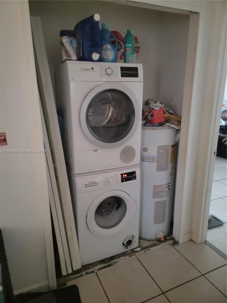 1670 Harding Street Hollywood, FL 33020 - Photo 2 of 19 a utility room with dryer and washer