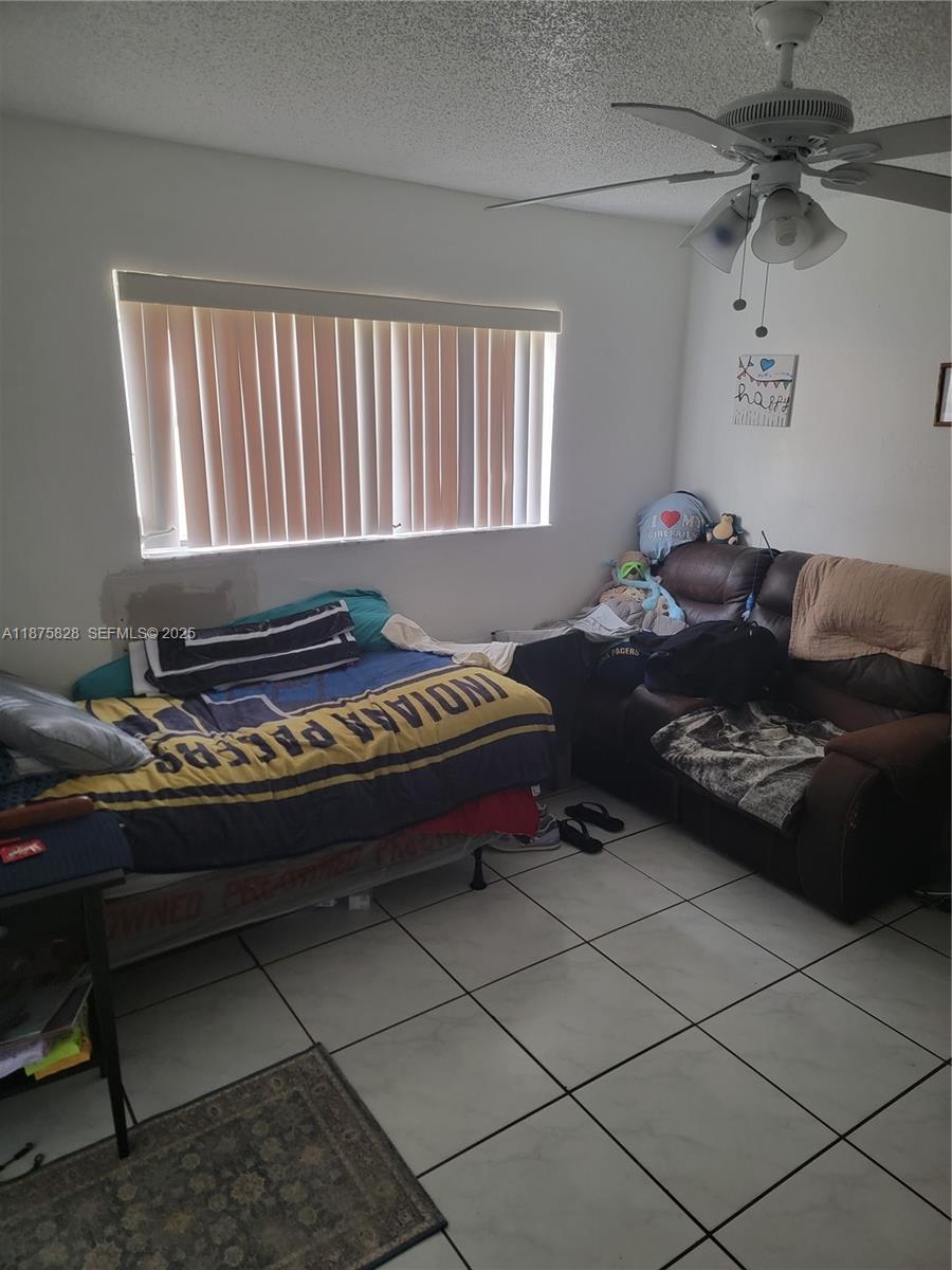 1670 Harding Street Hollywood, FL 33020 - Photo 3 of 19 a bed room with a bed and a window