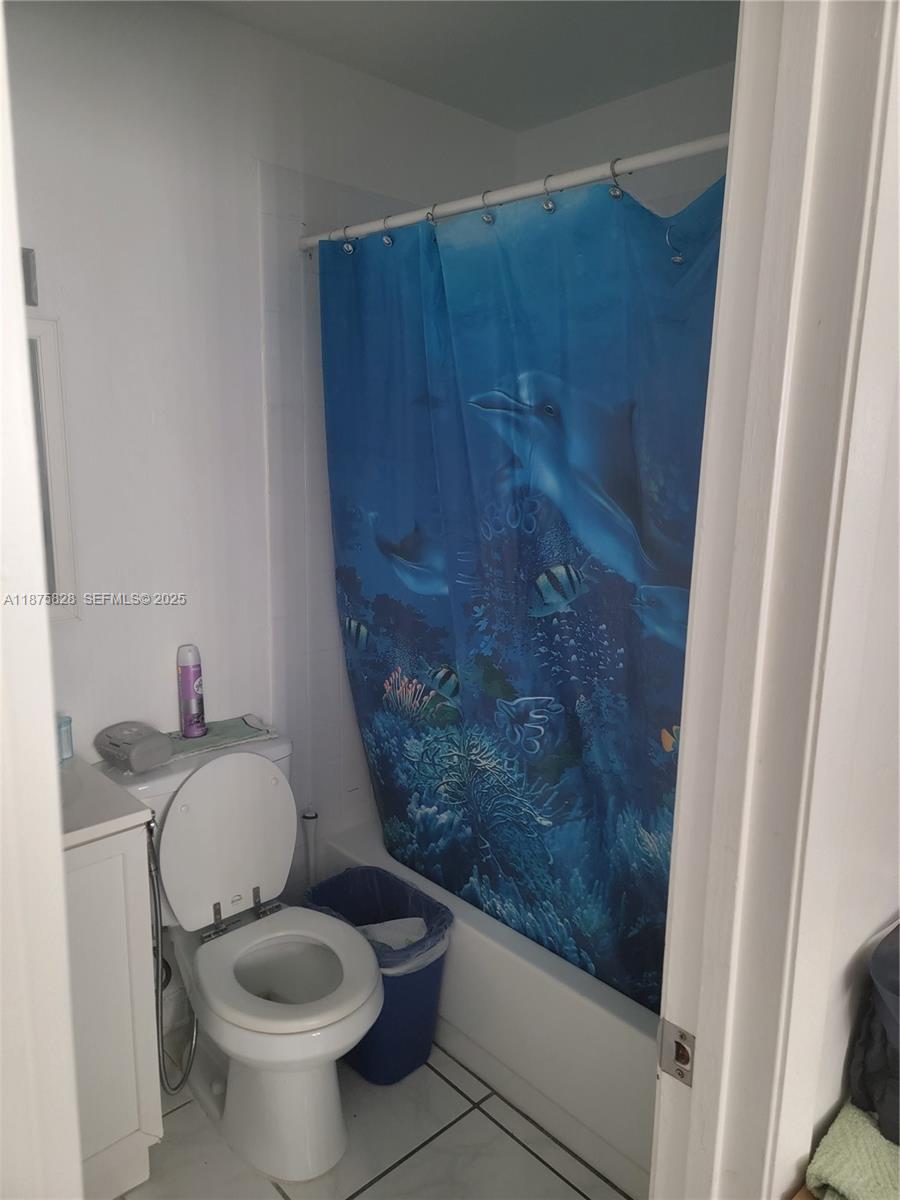 1670 Harding Street Hollywood, FL 33020 - Photo 5 of 19 a bathroom with a sink and a toilet